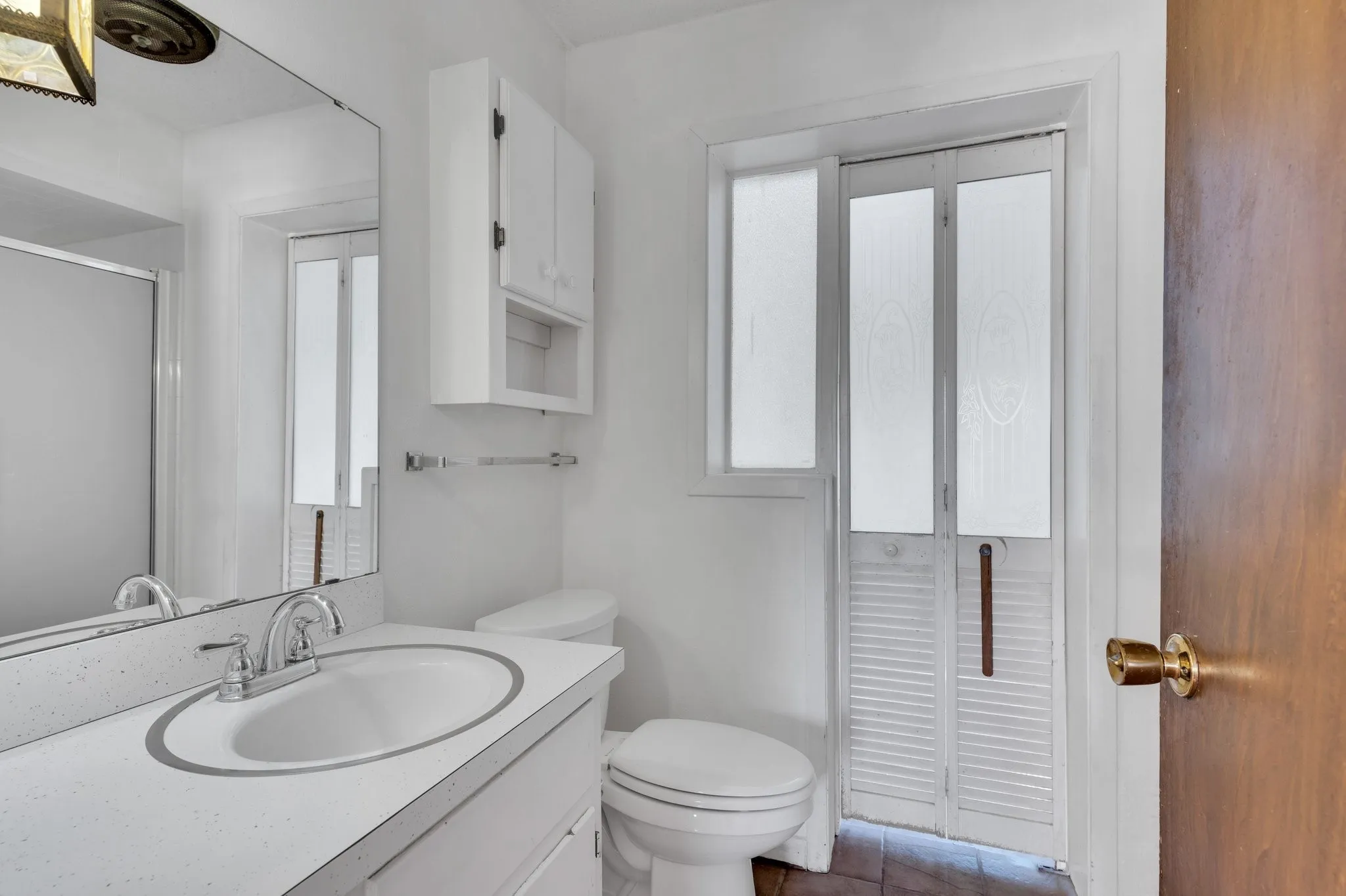Master Bathroom with vanity, a shower with shower door, and tile patterned floors