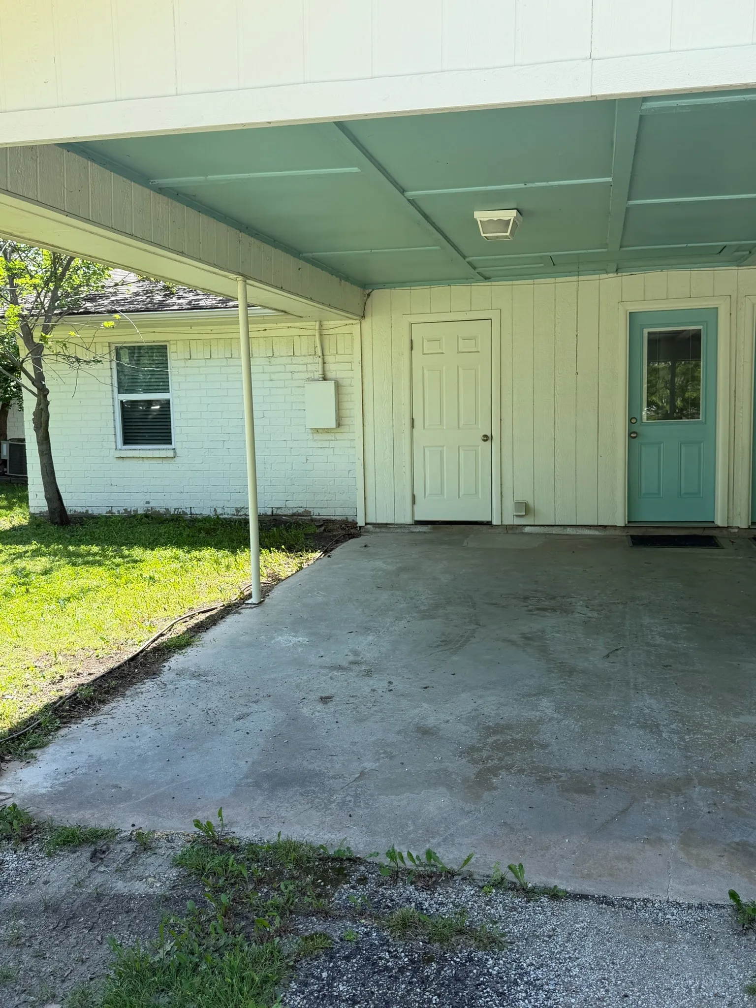 View of patio with an attached carport