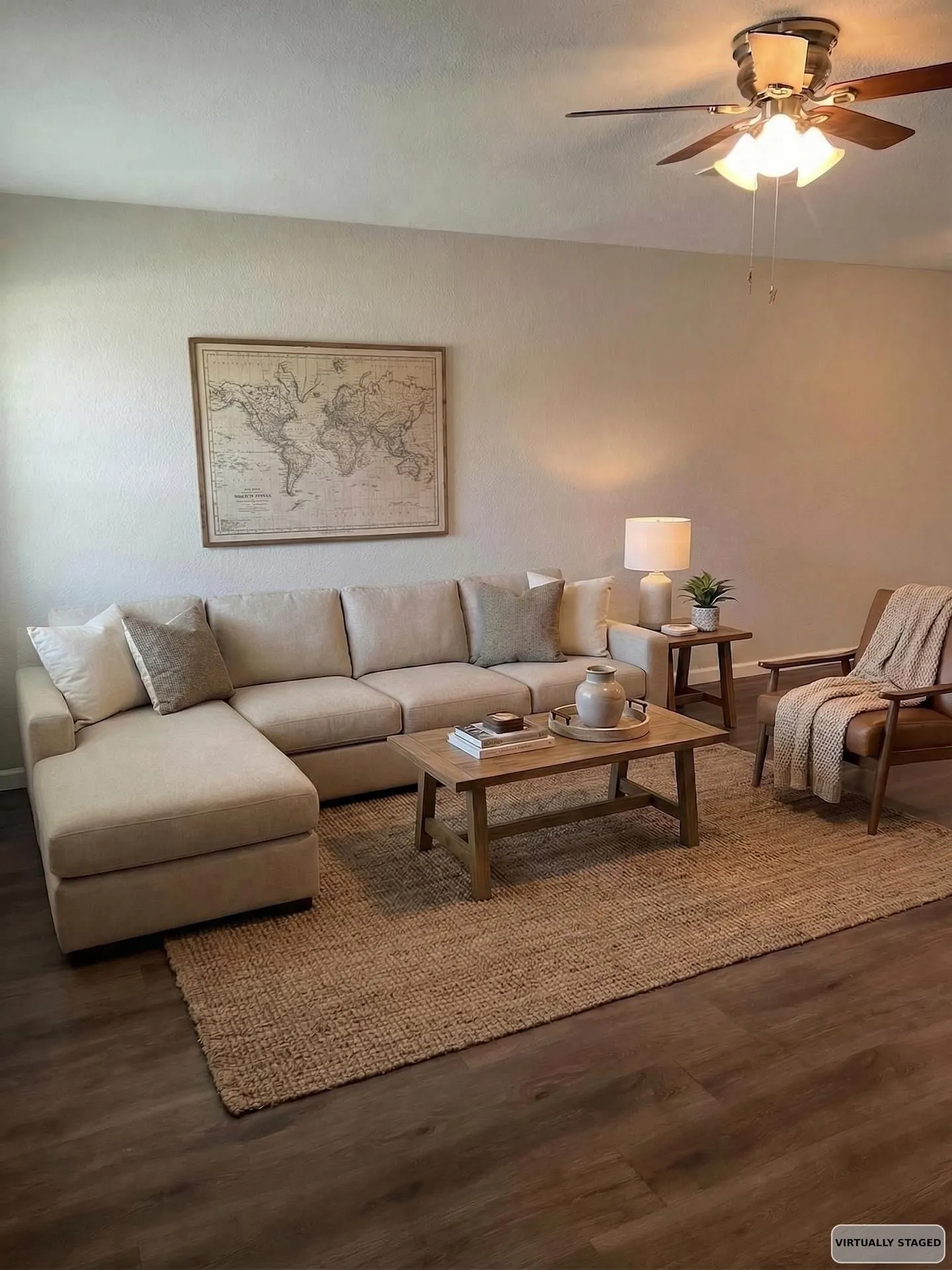 Living area features durable Luxury Vinyl Plank with Ceiling Fan