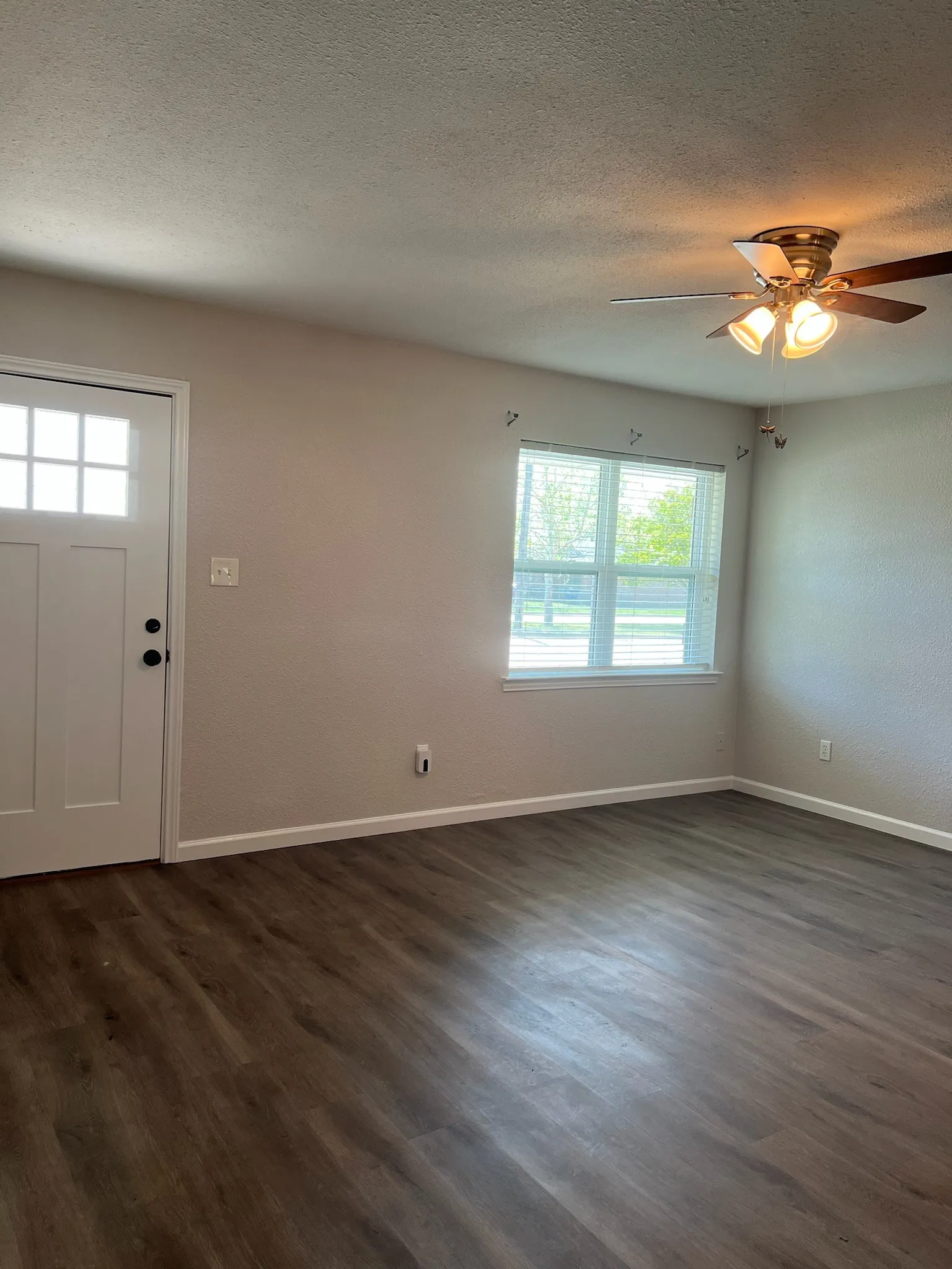 Front entry into Living area with Craftsman-style Door