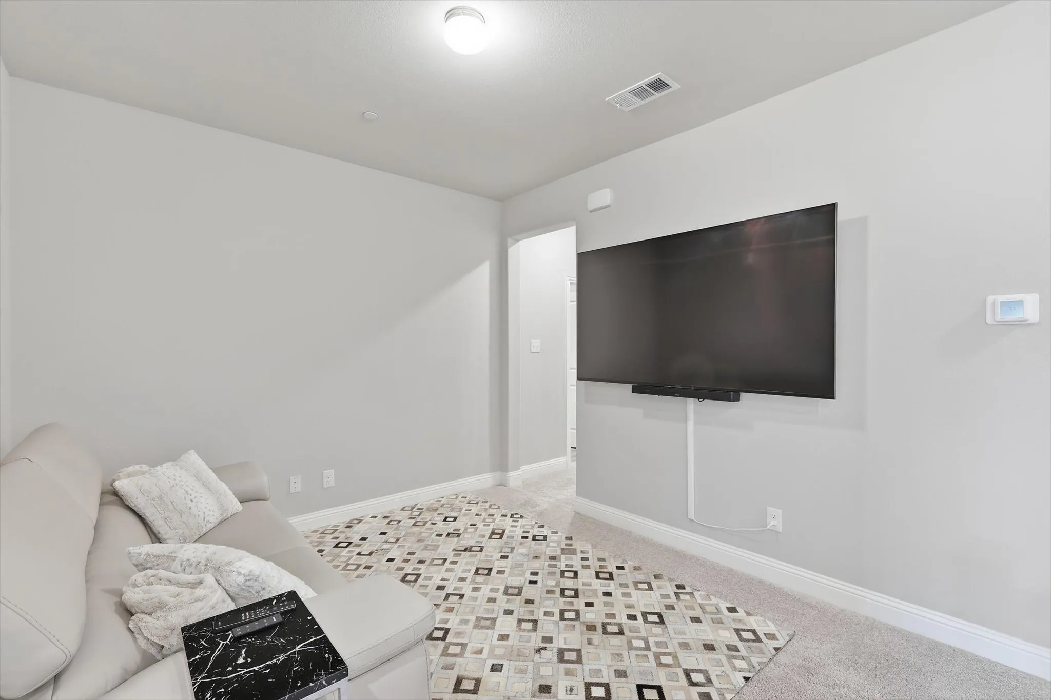 The Family Room offers a Quiet, Versatile Environment ideal for Relaxation or Entertainment with a Warm and Comfortable Ambiance.