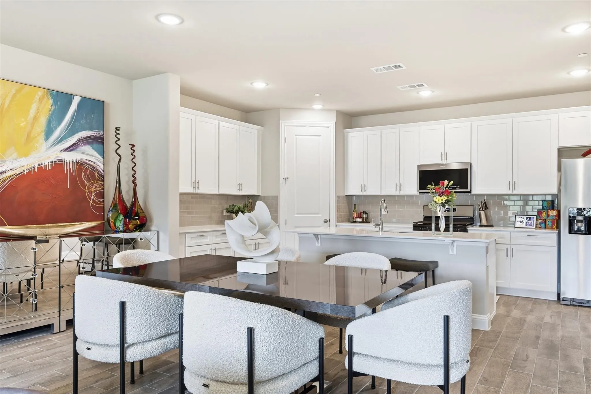The Large Dining Area offers ample space for a Large Dining Table, Buffet, and Dry Bar, making it perfect for Entertaining and Everyday Dining.