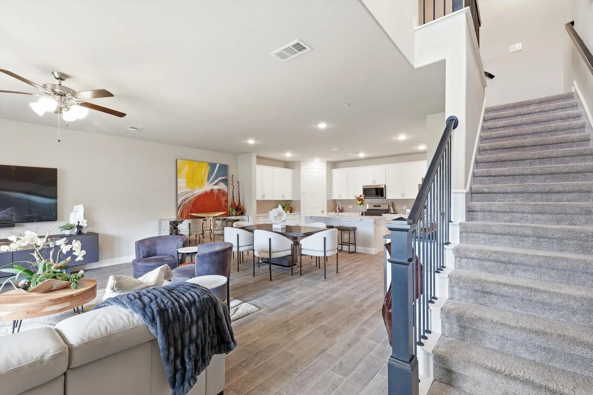 Once you enter this Luxurious Townhome you'll notice the Bright Open-Concept and Spacious and Airy Layout starting with your first step onto the Upgraded Wood-Look Tile Flooring with Durability and Warmth that Extends throughout the Main Floor.