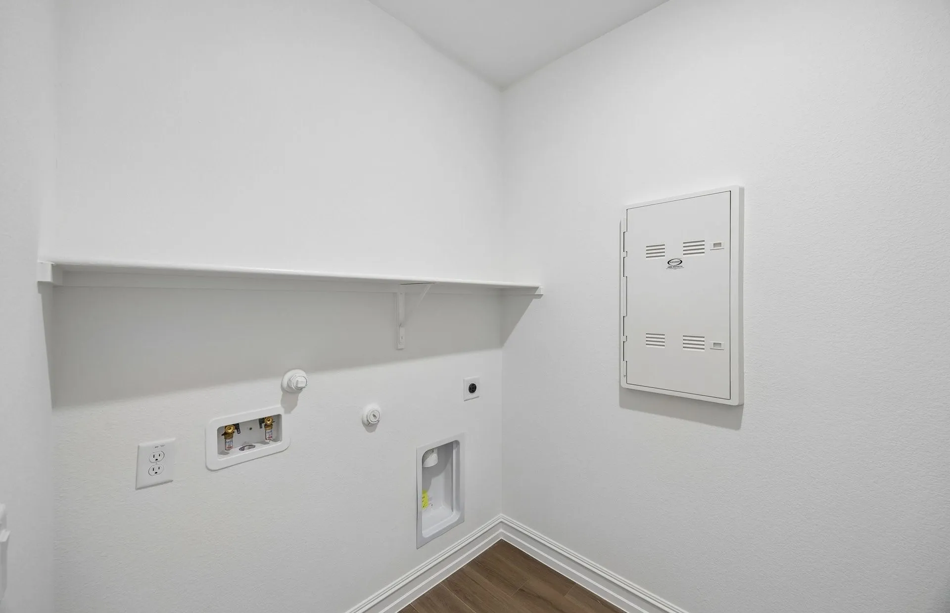 Laundry room with built-in shelving