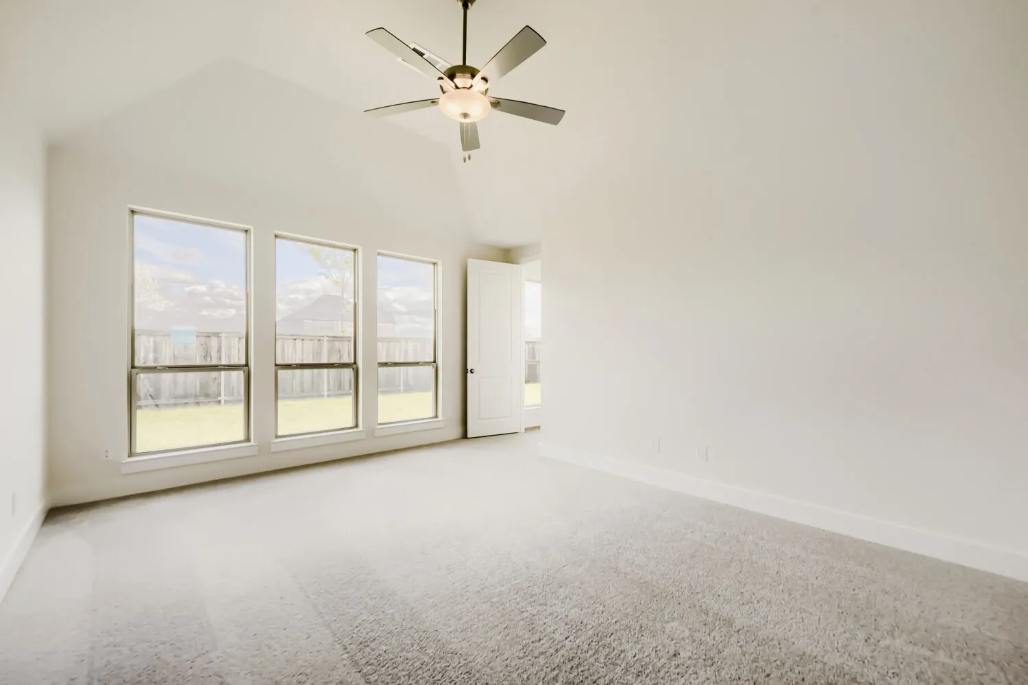 Vaulted ceiling with an integrated ceiling fan and light fixture