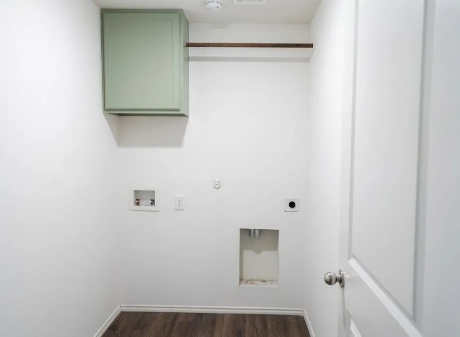 Laundry area with hookup for a washing machine, dark wood-type flooring, gas dryer hookup, electric dryer hookup, and cabinet space