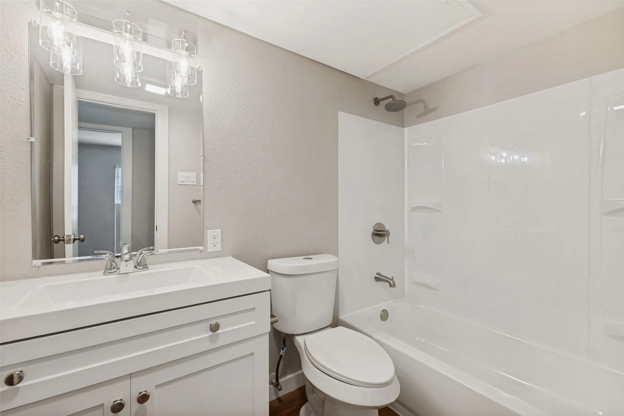 The bathroom stands out with its fresh, immaculate finishes and stylish design details. Everything is new, clean, and so very pretty.