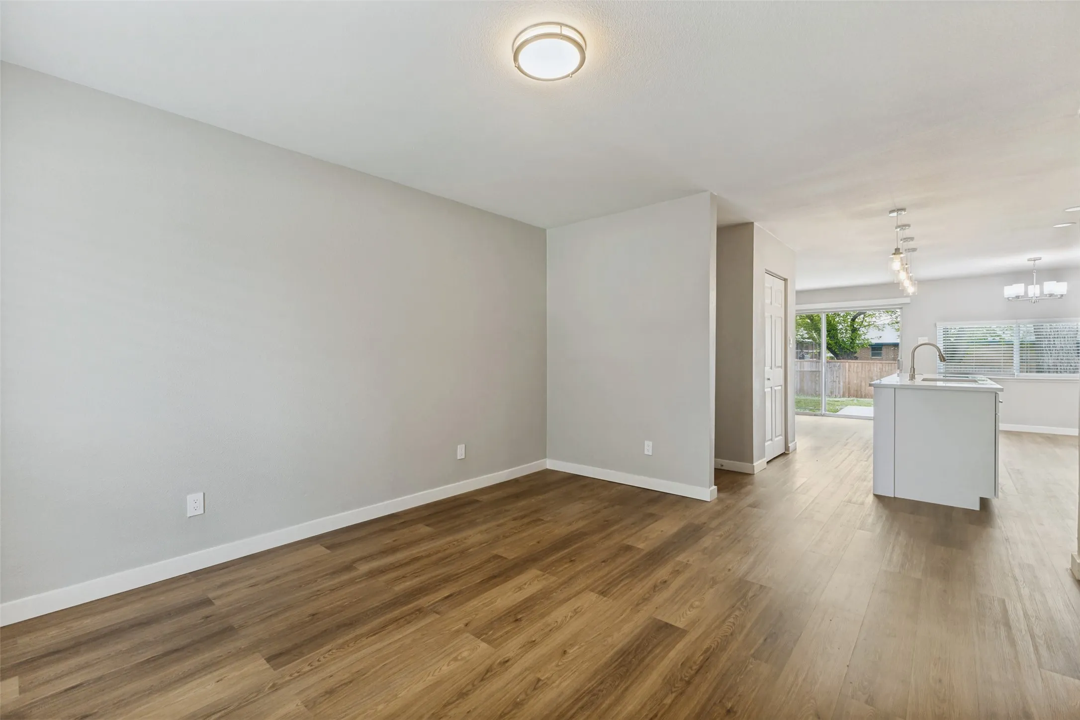 The open living area seamlessly flows into the kitchen with a fantastic center island perfect for casual dining and entertaining