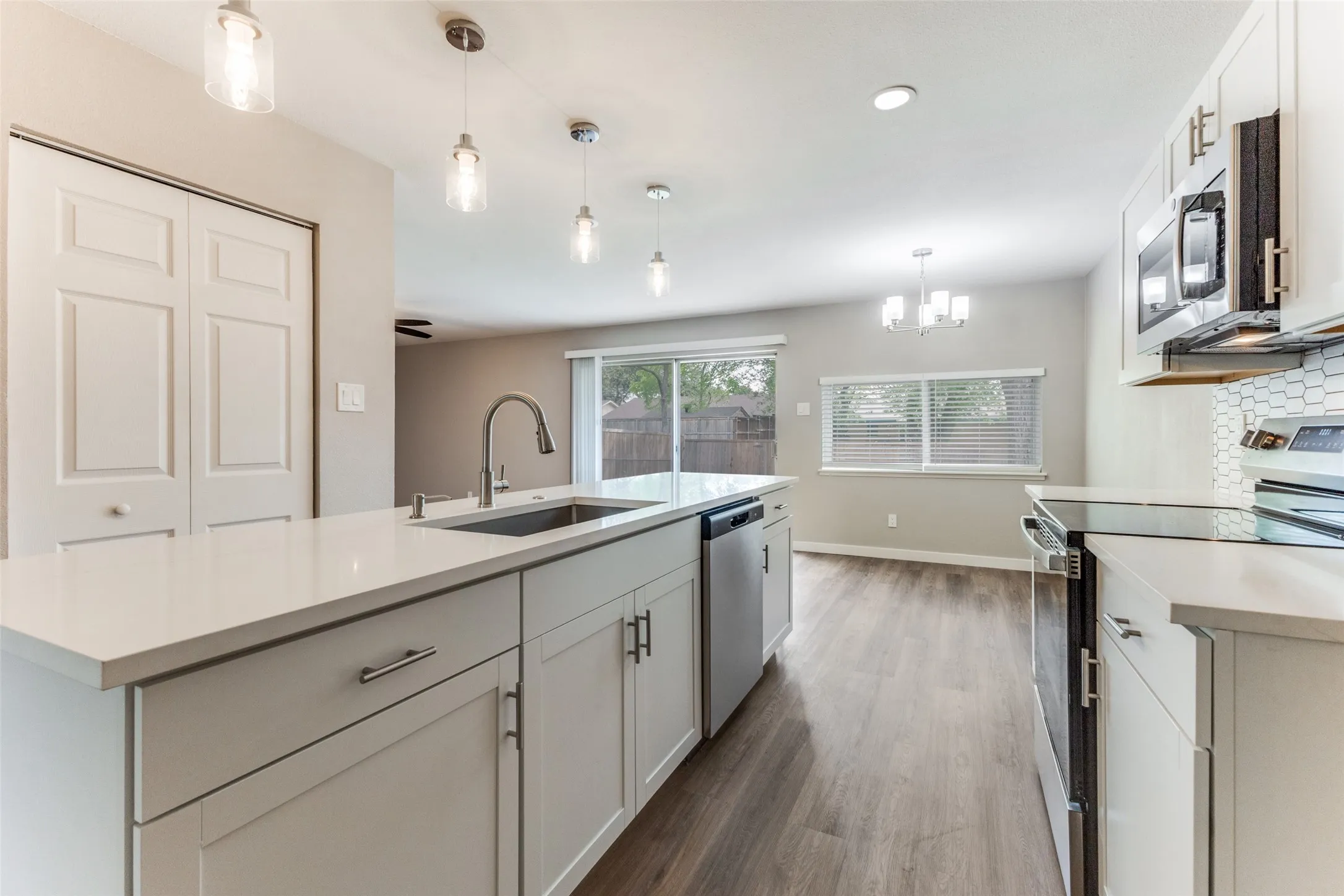 Got space? Yes you do! All the conveniences of a pantry plus the laundry utility area!