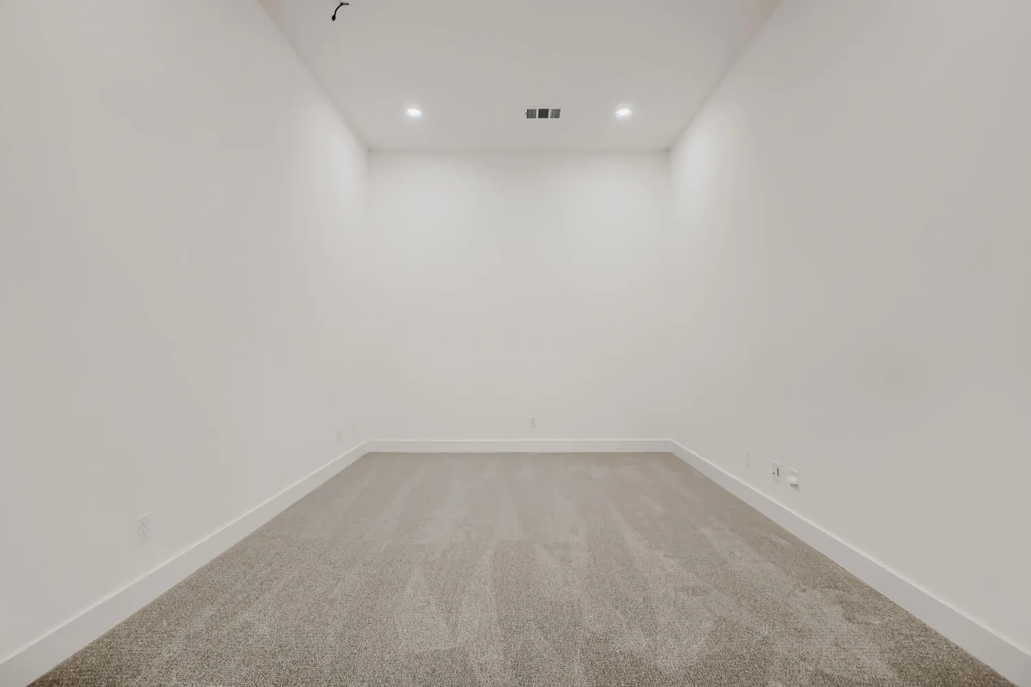 Carpeted room featuring recessed lighting, white walls, and white baseboards