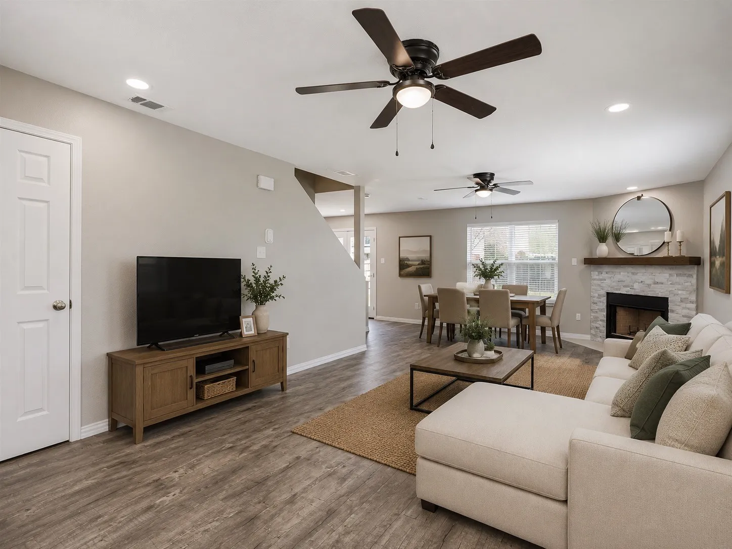 AI enhanced Spacious living area featuring wood-finish flooring, recessed lighting, and ceiling fans