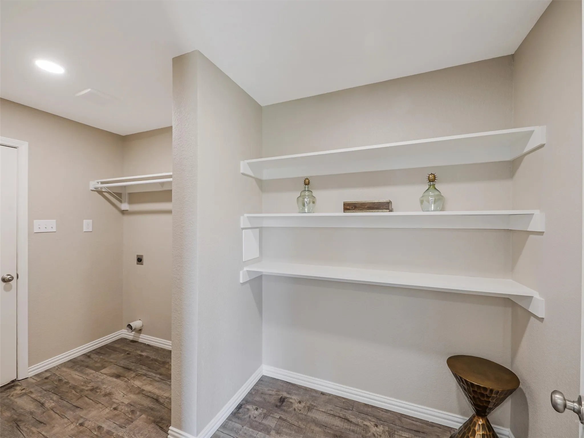 Dedicated laundry area featuring stainless steel appliances