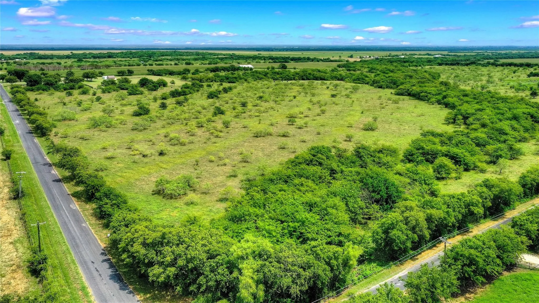 Looking east on Southmayd Rd, go east, away from Winn Rd to just past the thick group of trees on the right and Lot 2 starts where you see the 1st telephone pole across the street. Go about 200 more ft to end of Lot 2.