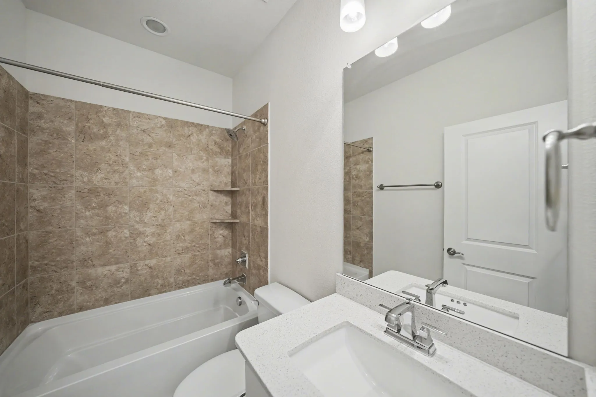 Bathroom featuring shower / bath combination and vanity