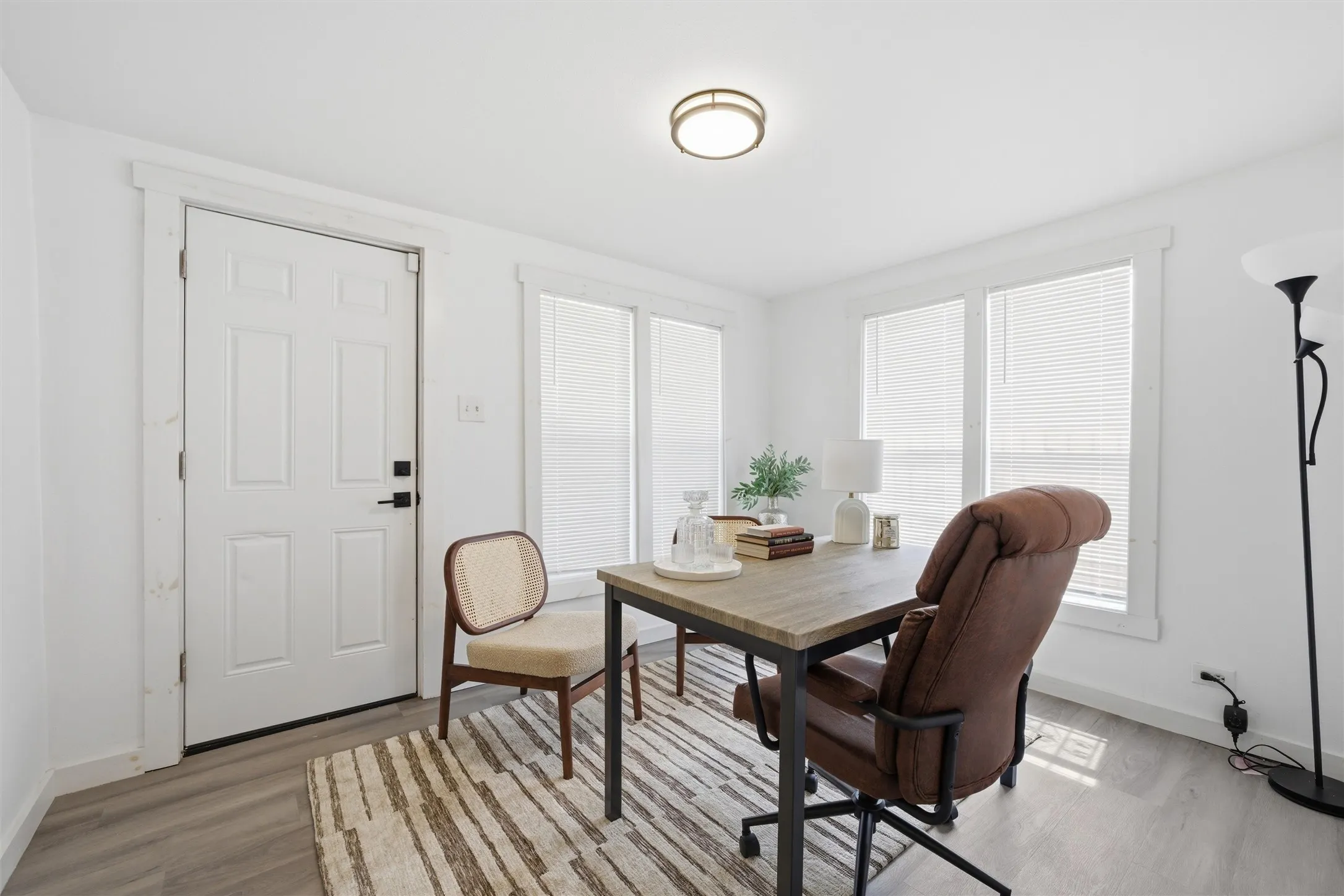 Dining area with light wood-type flooring