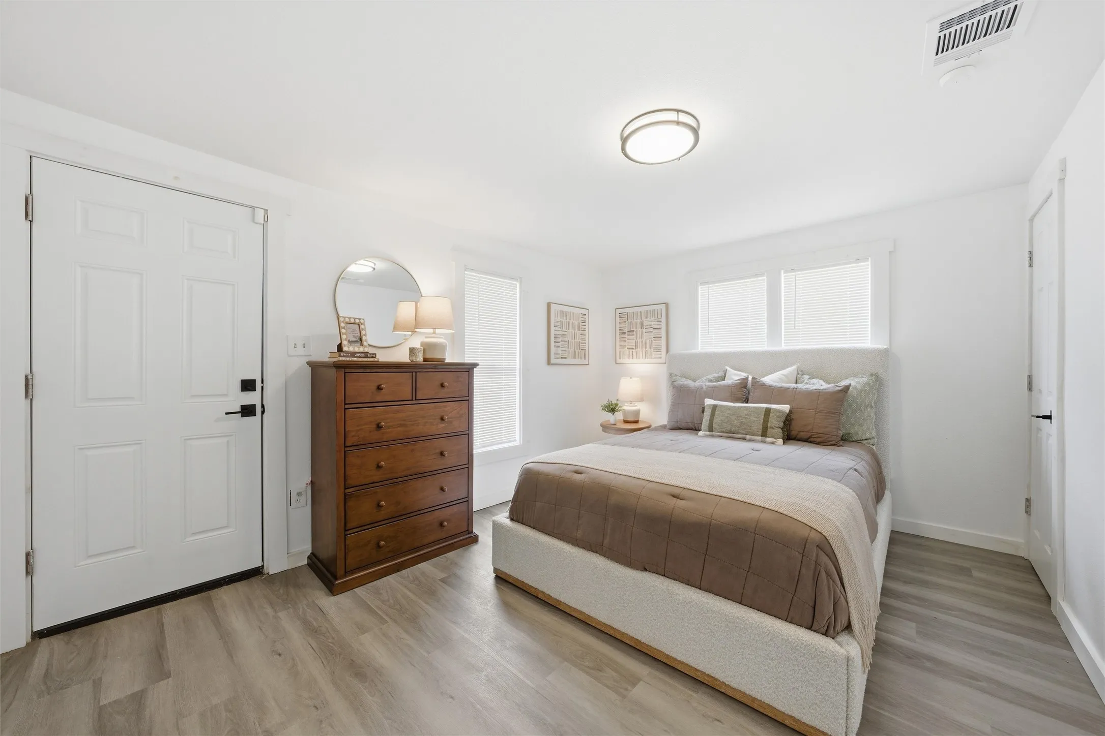 Bedroom with light wood-style floors