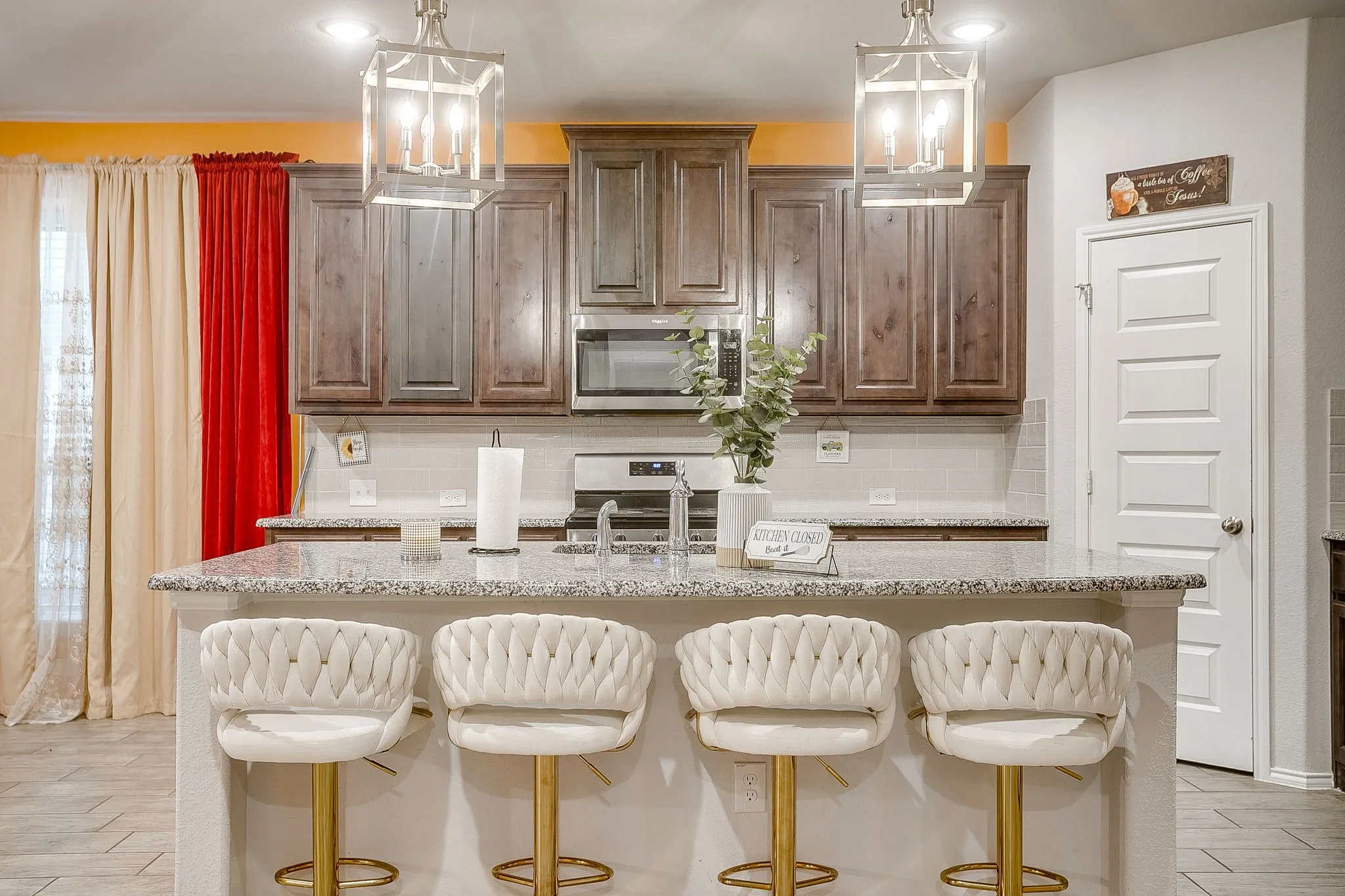 Large kitchen island with breakfast bar. Walk in pantry too.