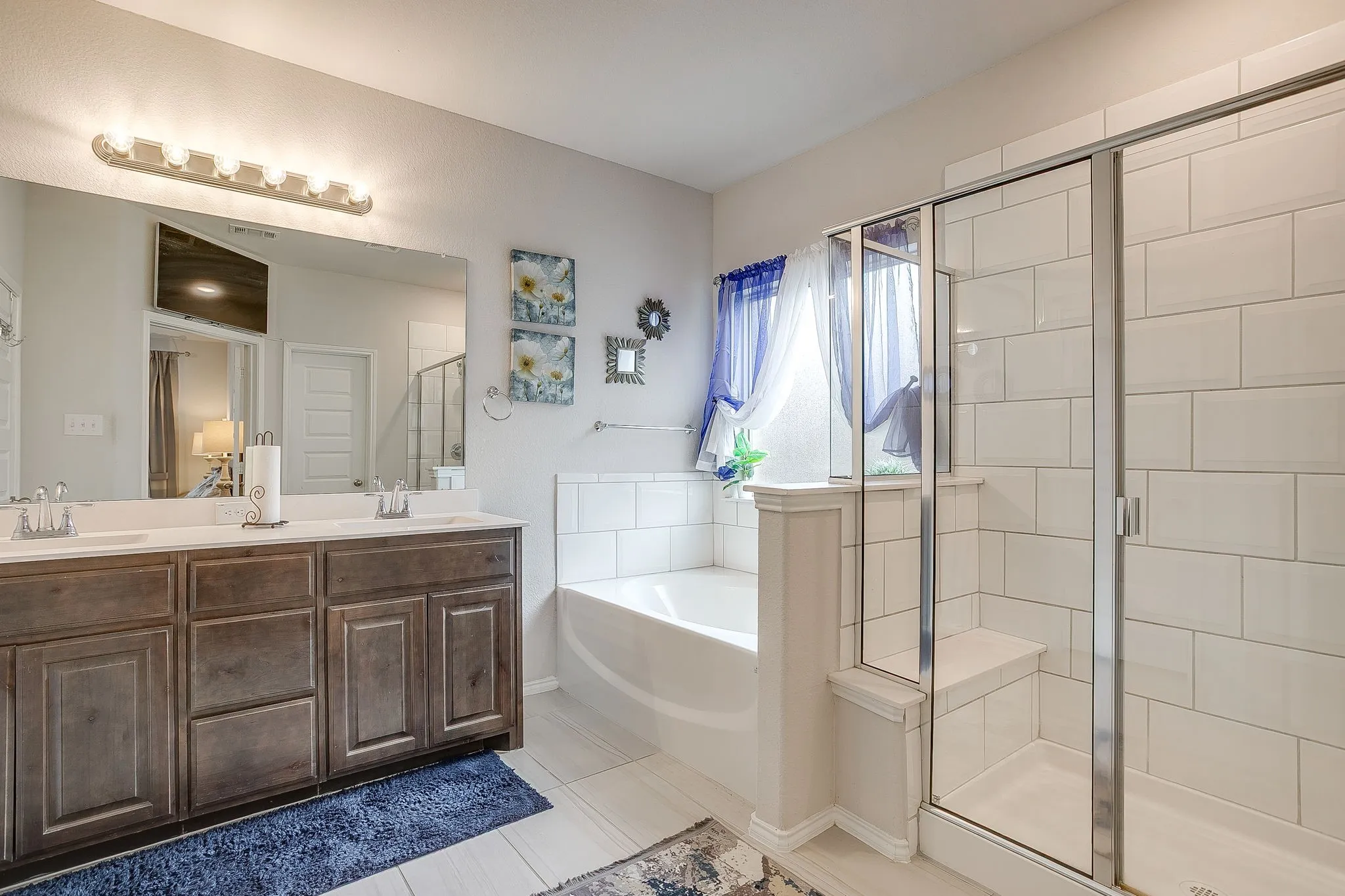 Separate tiled shower and garden tub.