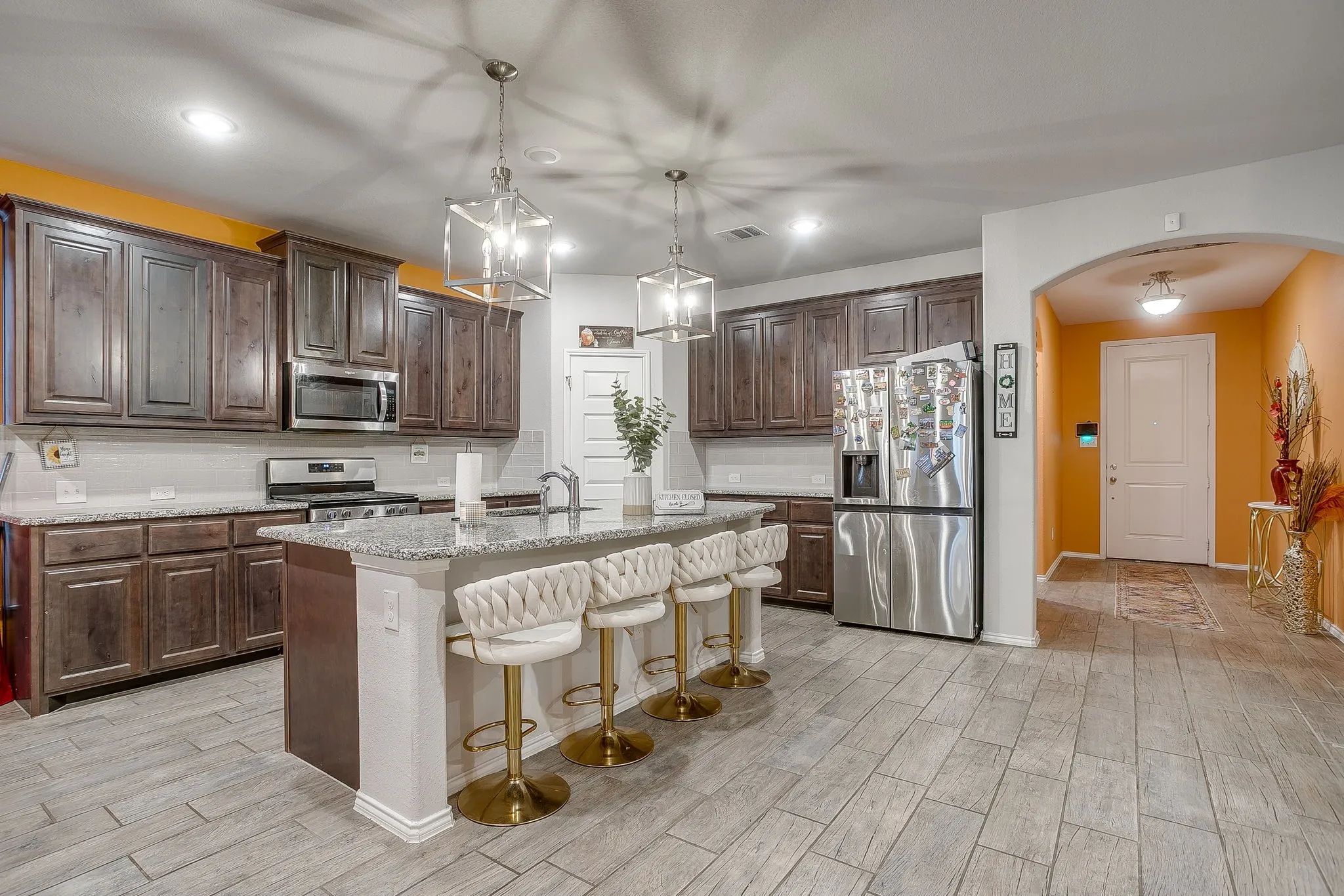 Granite counter tops and wood look floors.
