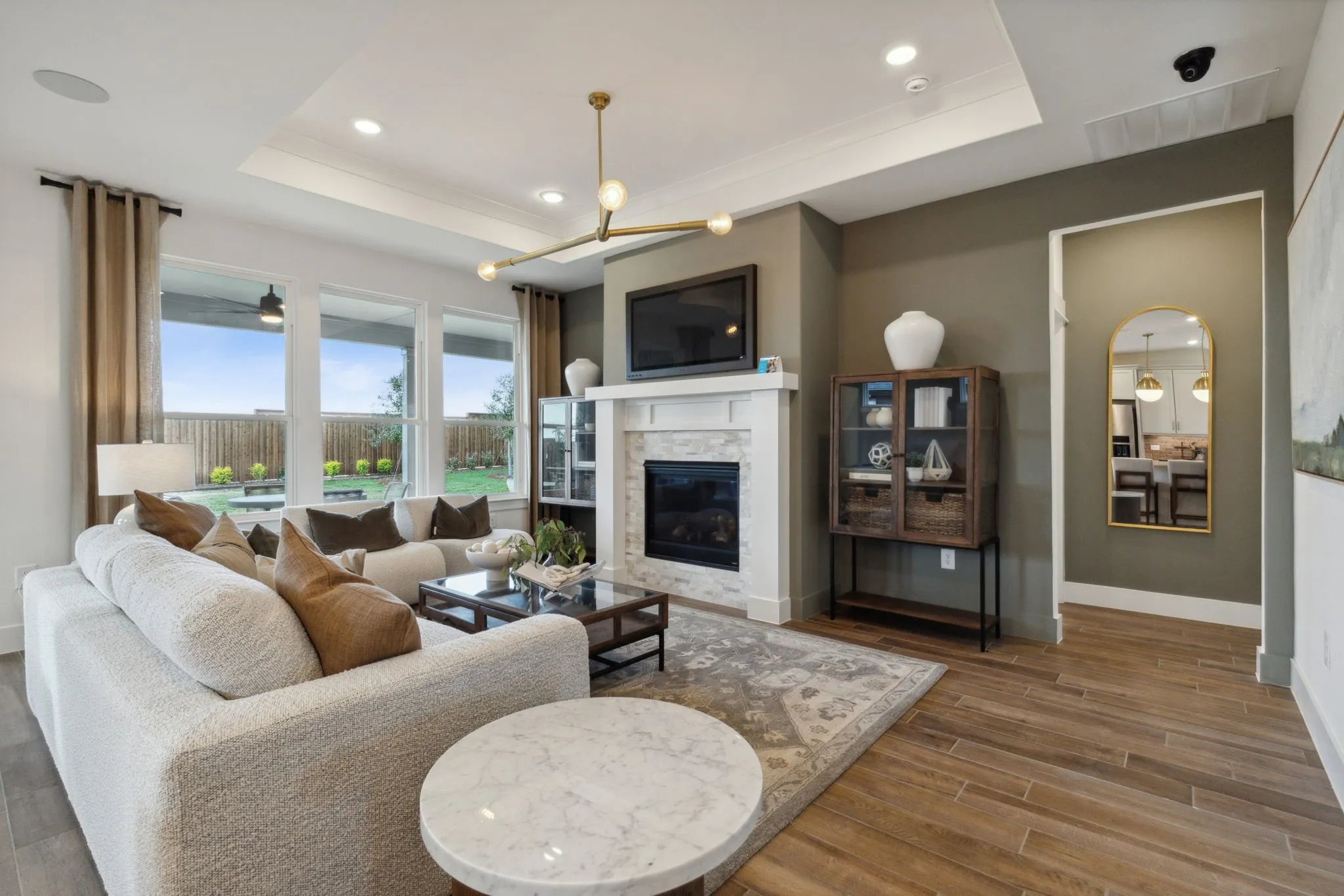 *Model Representation - Spacious gathering room with large windows
