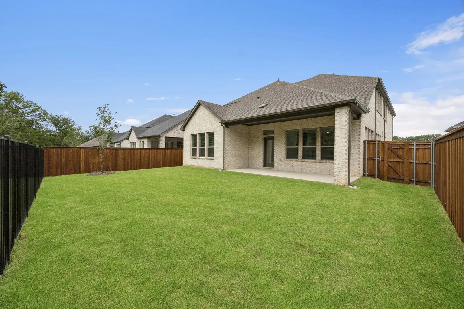 Covered Patio in the Monet II home plan by Trophy Signature Homes – REPRESENTATIVE PHOTO