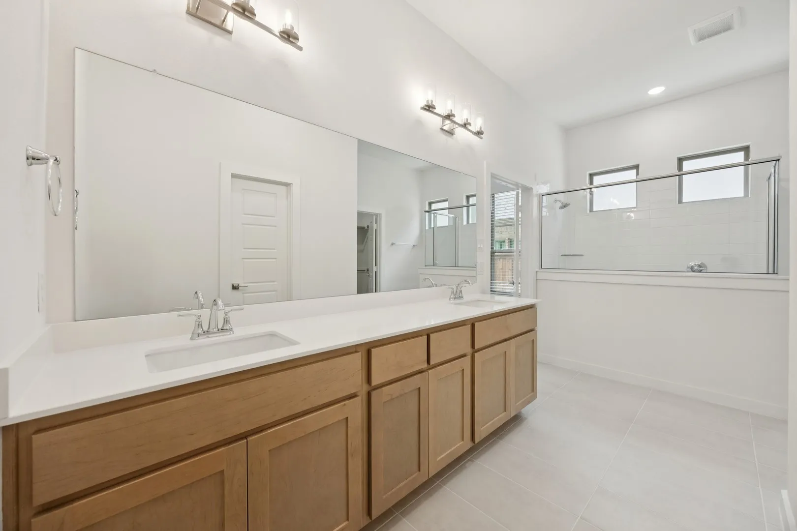 Primary Bathroom in the Monet II home plan by Trophy Signature Homes – REPRESENTATIVE PHOTO