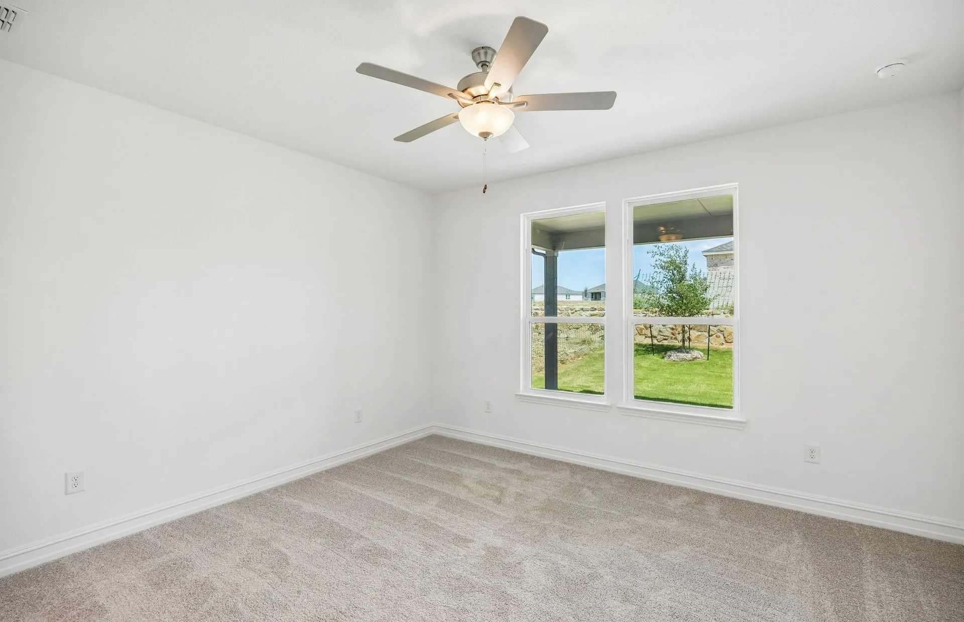 Primary bedroom with large window