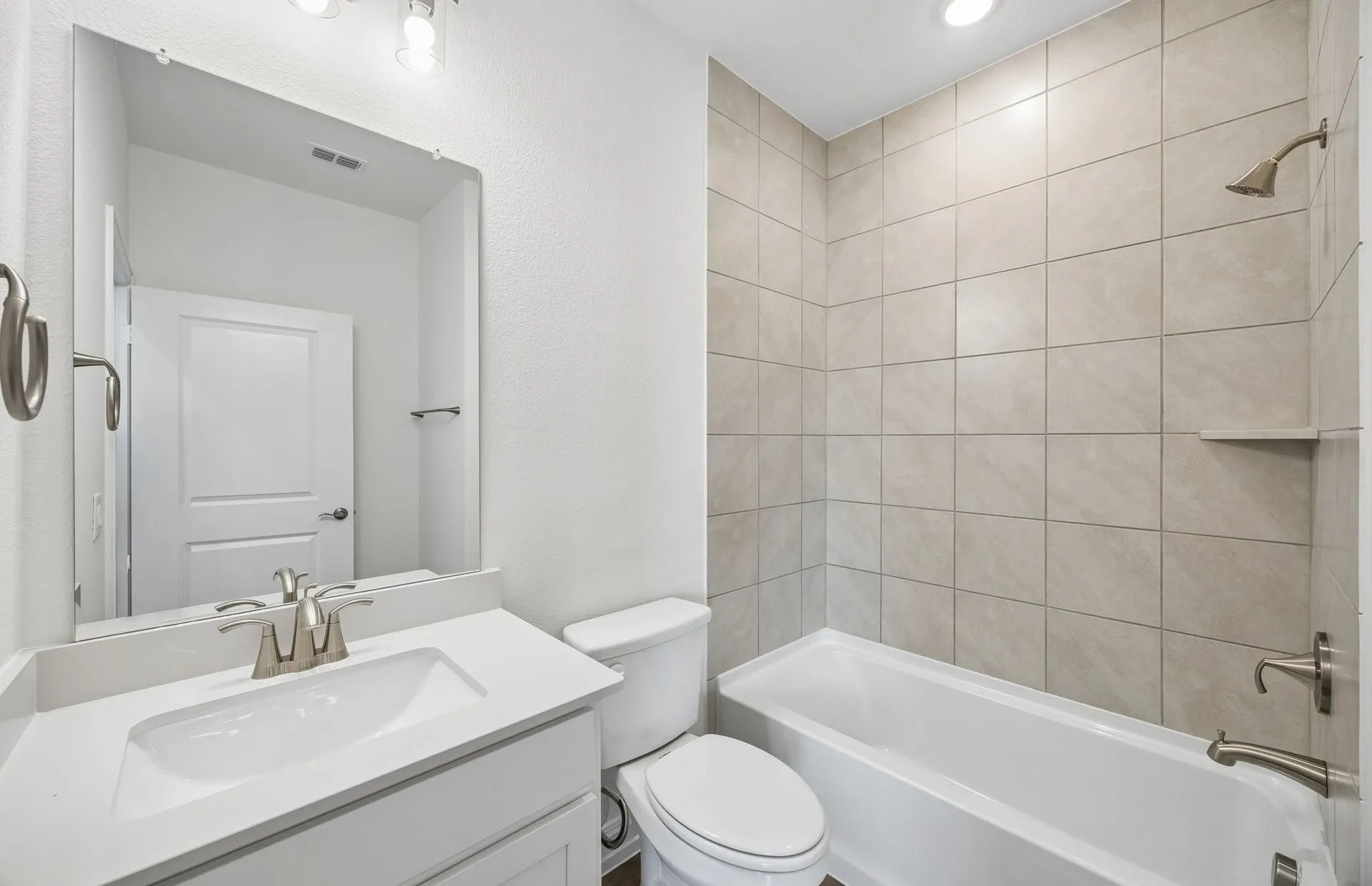 Secondary bath with tile surrounded shower