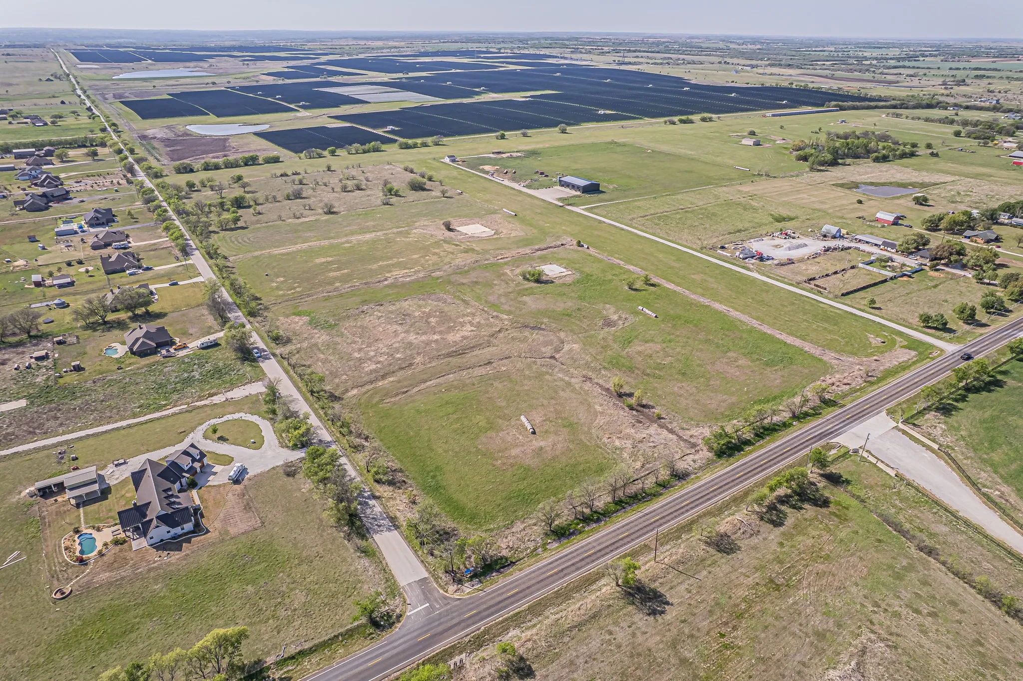 Aerial view of property and surrounding area with rural landscape and abundant farmland