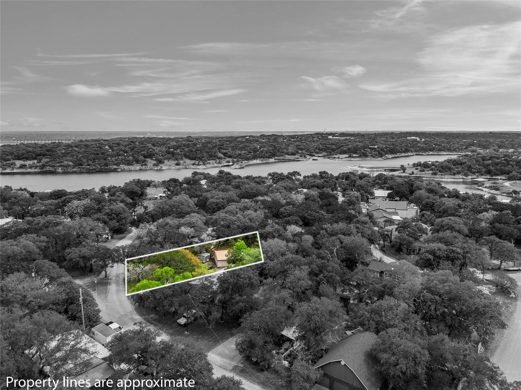 View of property location with property parcel outlined and a large body of water
