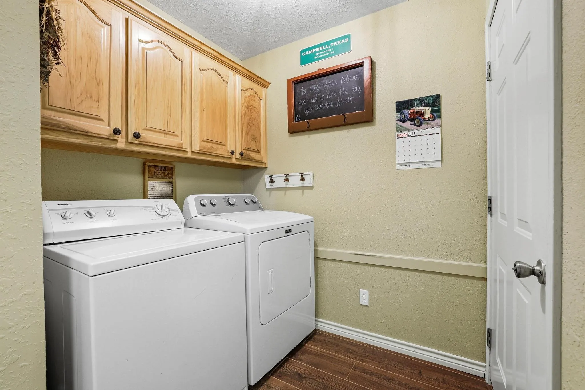 Full size laundry area with storage