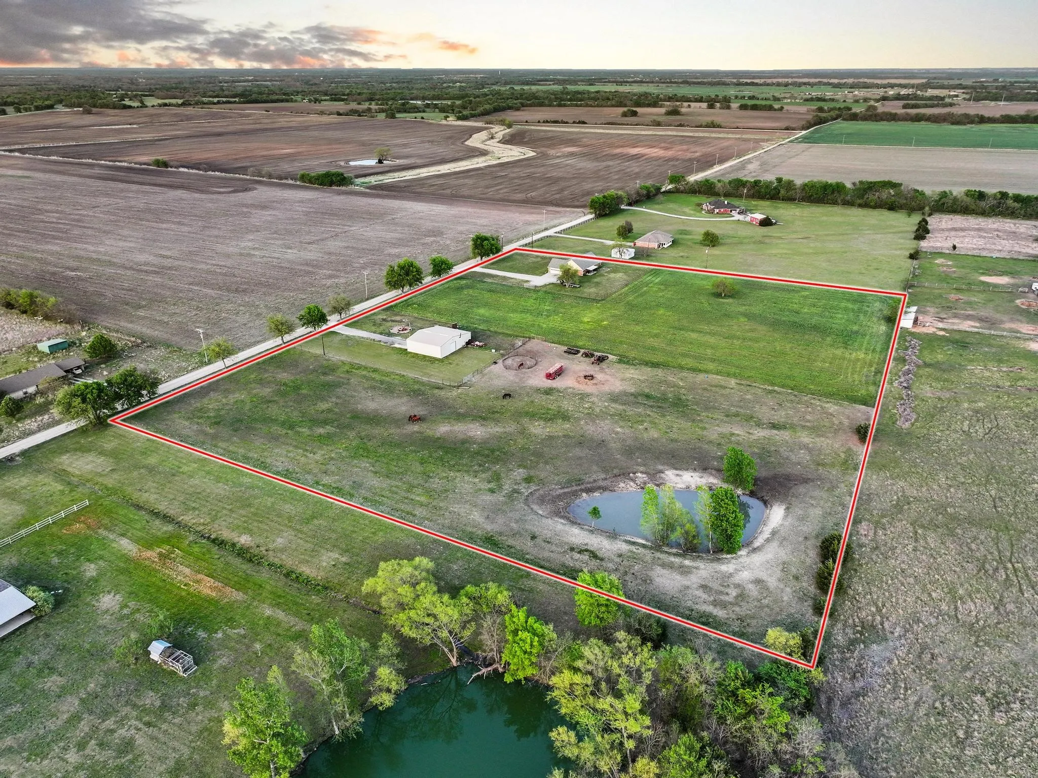 Fenced acres around the barn and pond. House and about 2 acres unfenced for home and yard