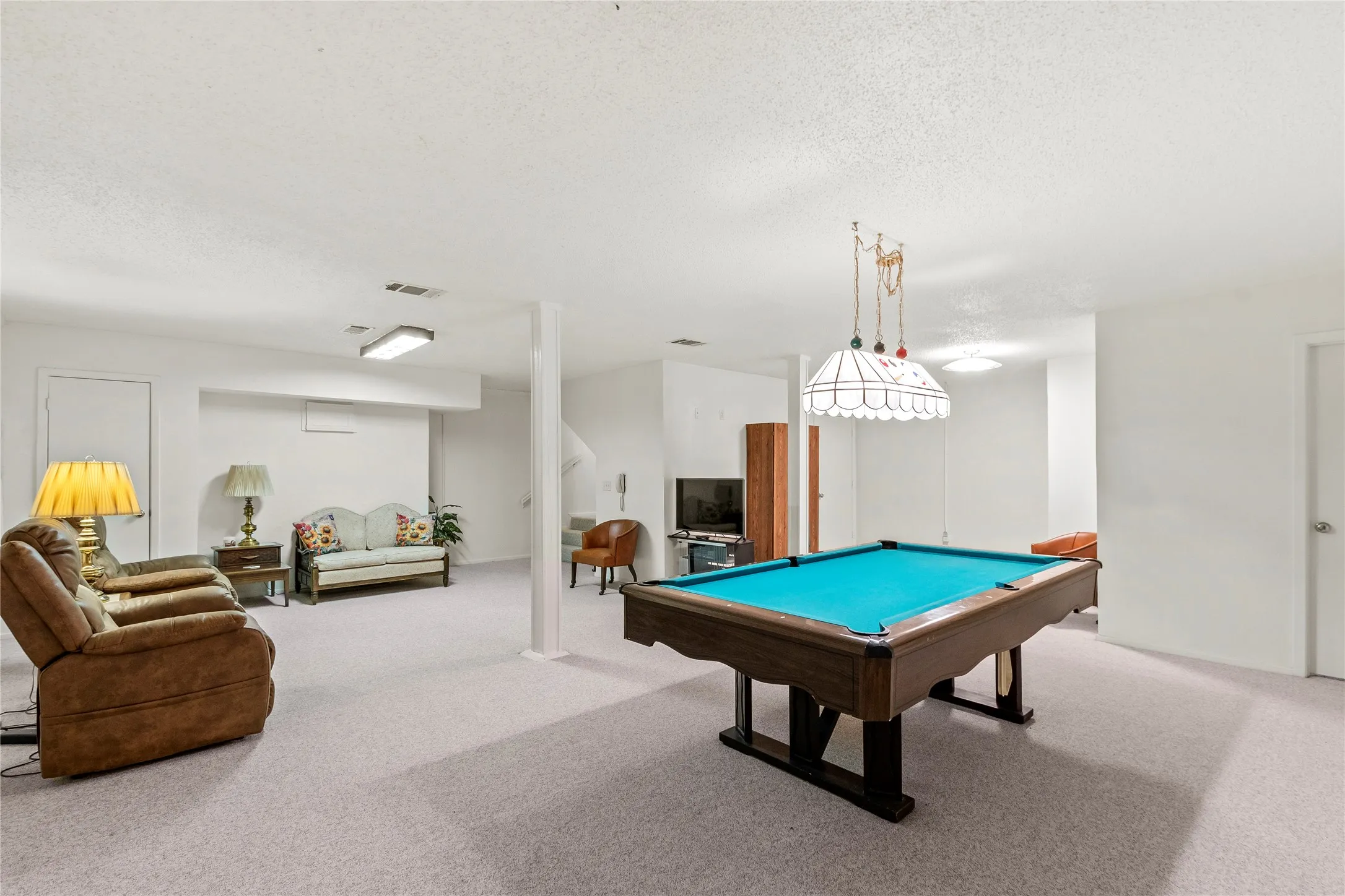 Downstairs bonus room, game room