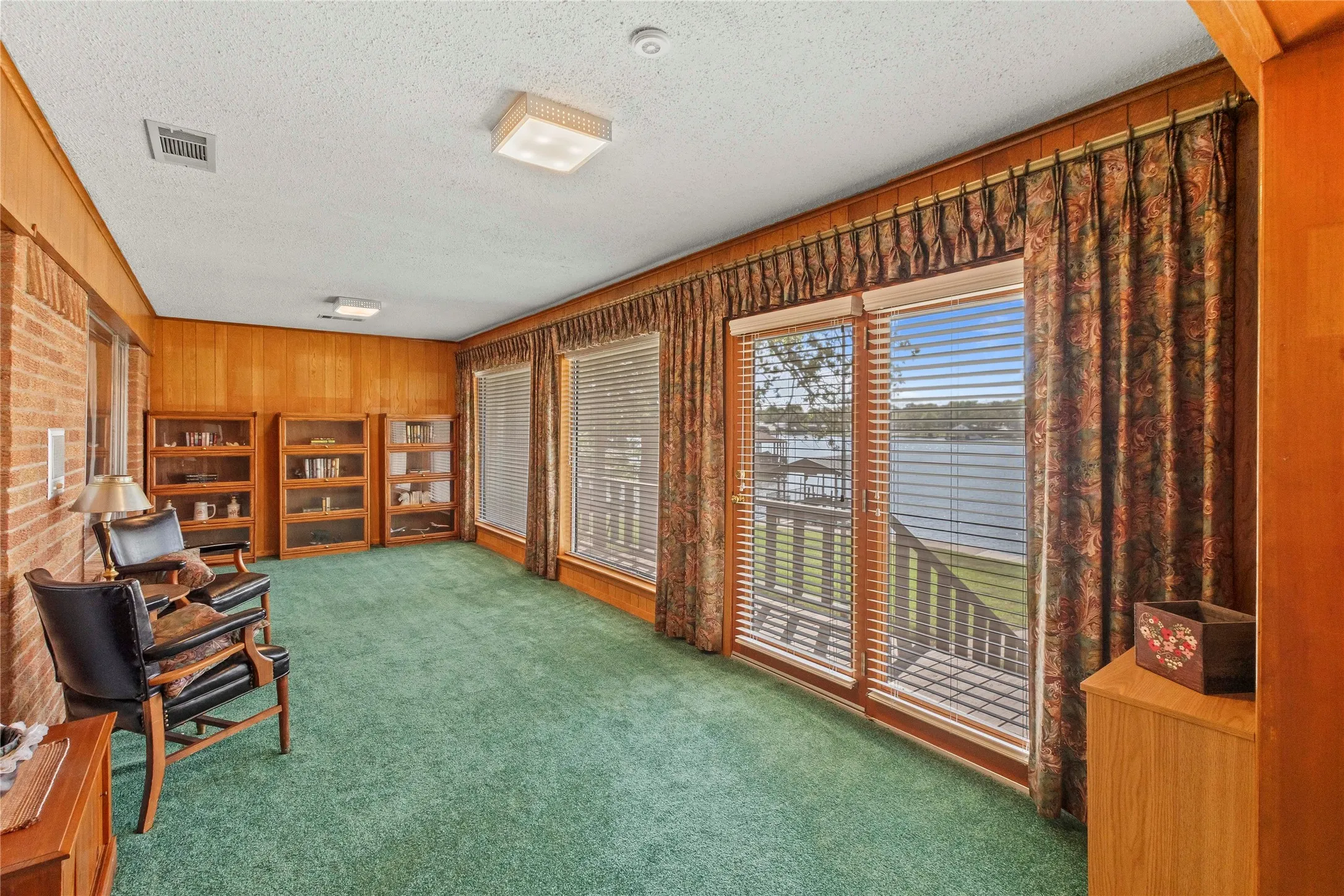 Enclosed Porch off the living area extends living space with great water views.