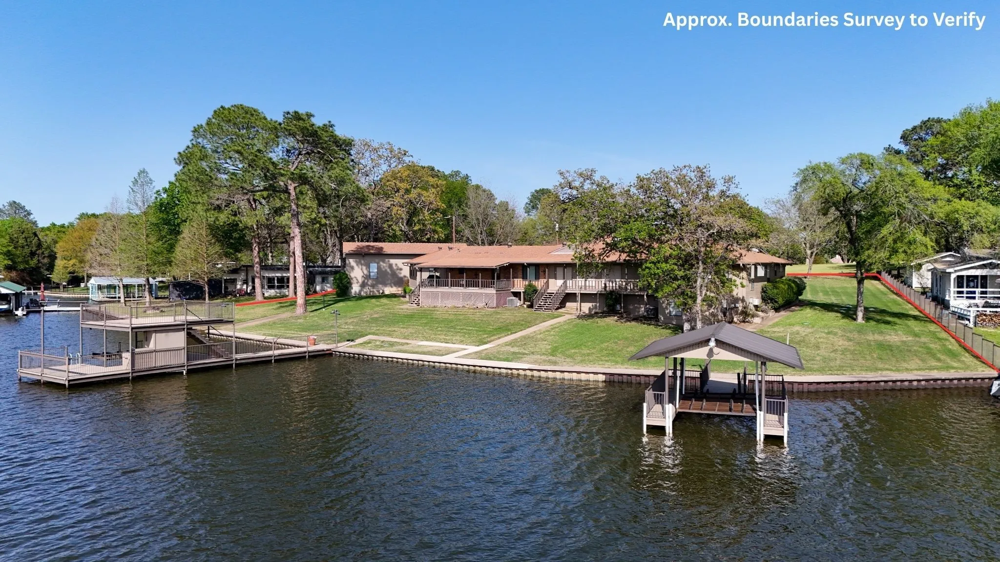 242 ft waterfront and two boathouses