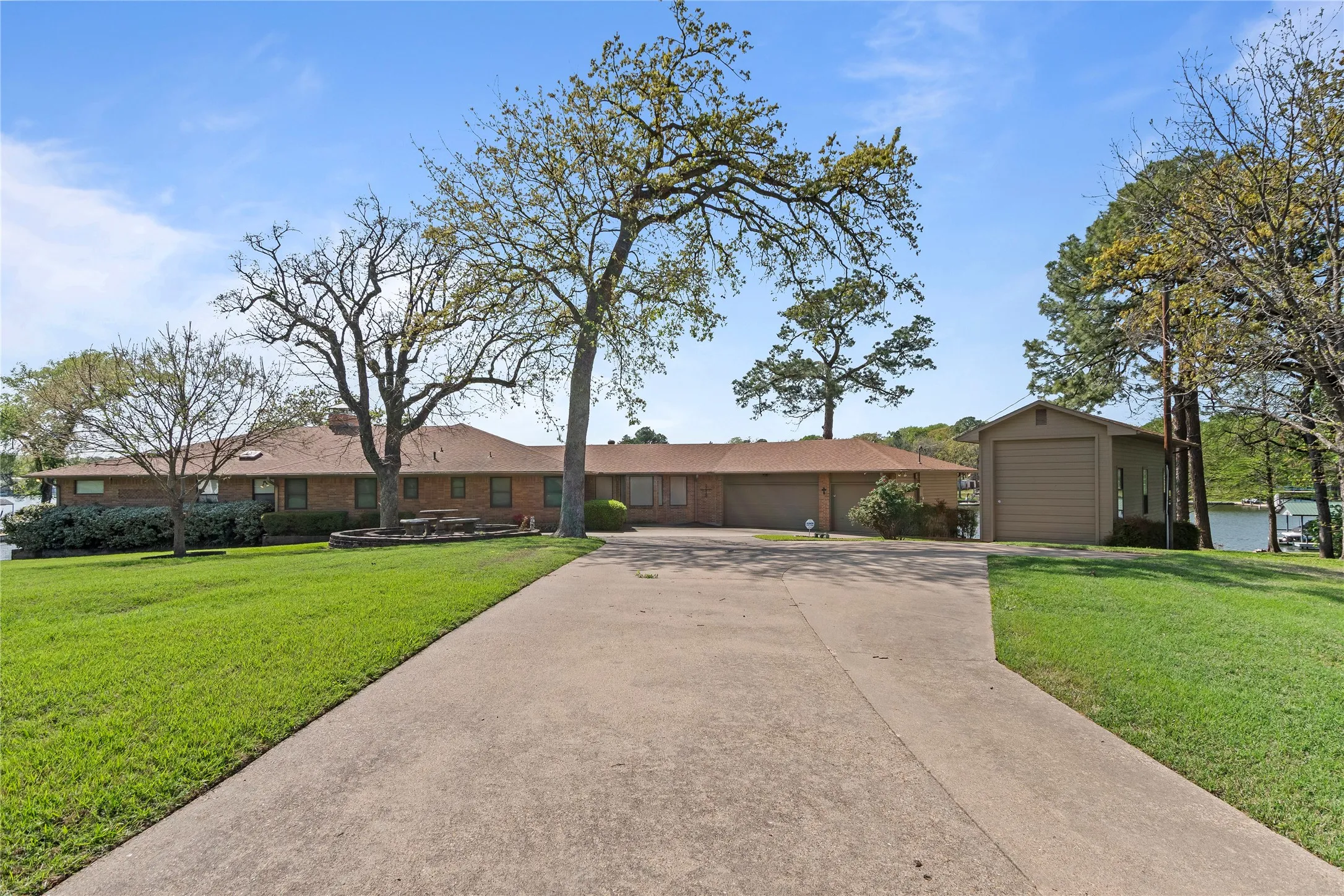 Home features 3 car garage with work shop plus separate RV garage and plenty of parking for several vehicles.