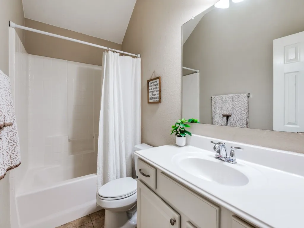The guest bathroom is ideally situated to provide easy access for both guest rooms.