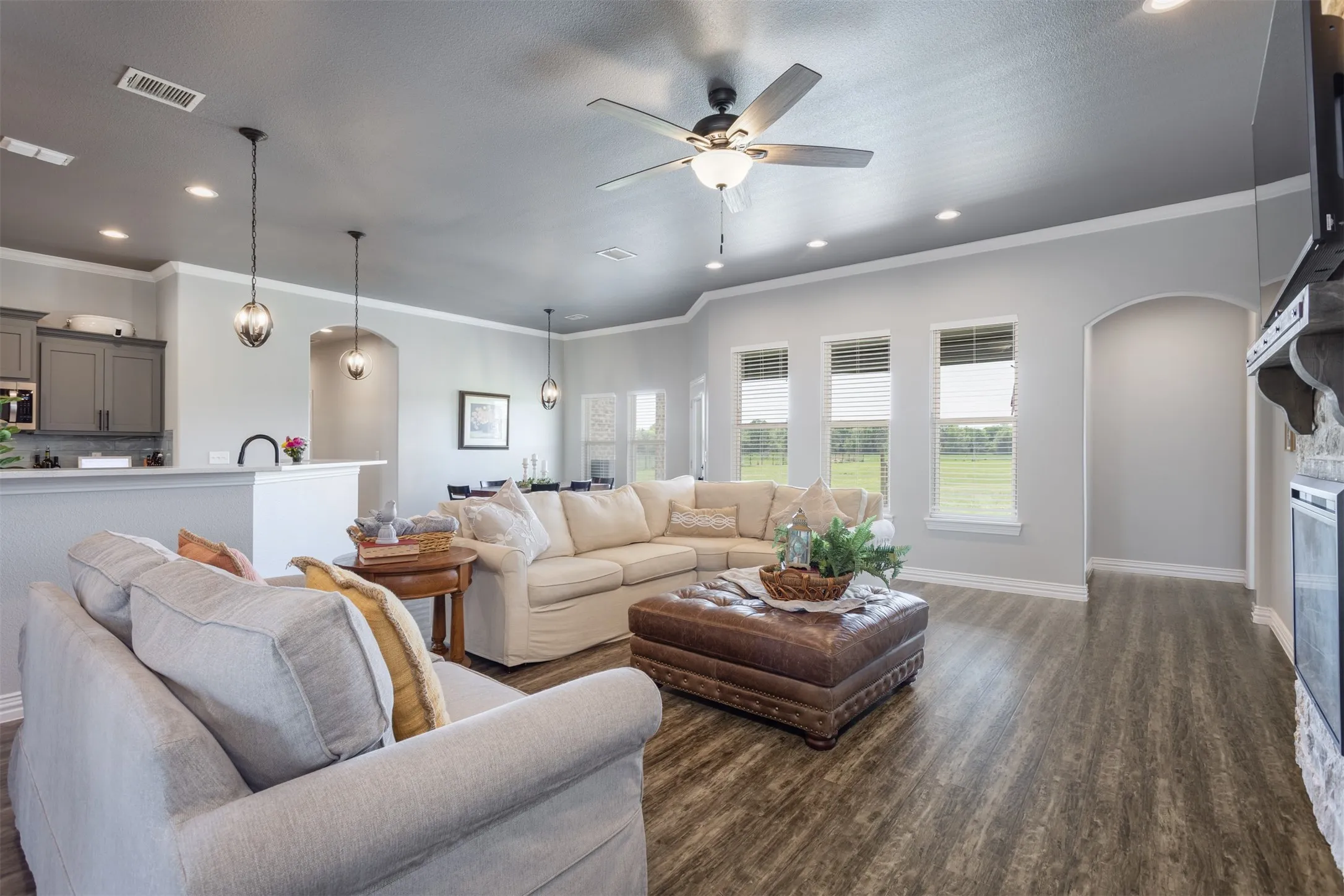 Large windows open to the lush backyard and acreage. Open concept allows for all to gather in one area.