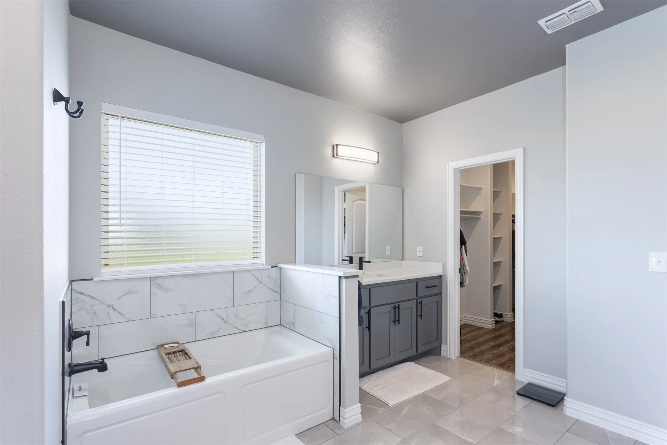 Spacious Primary bath has double vanities, soaking tub and large walk-in shower.