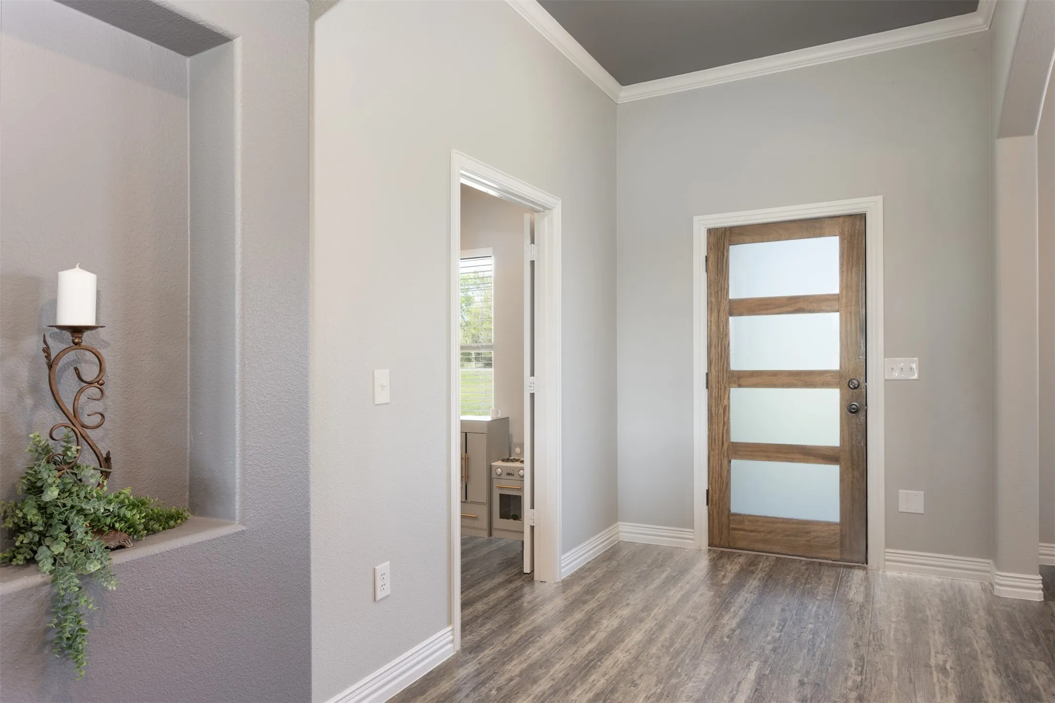 Spacious entry welcomes friends as you entertain.