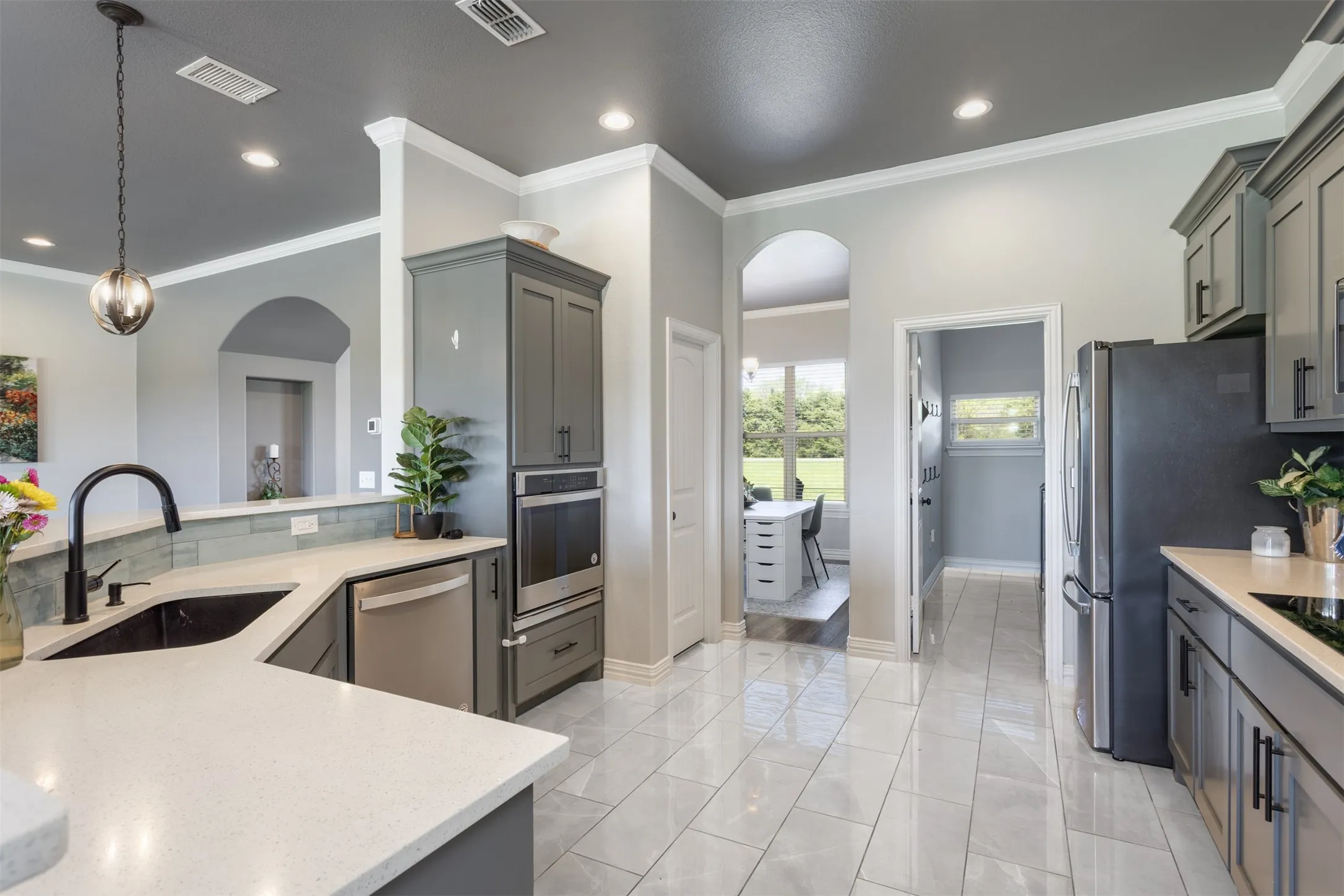 Bright kitchen and large pantry will delight the cook of the family