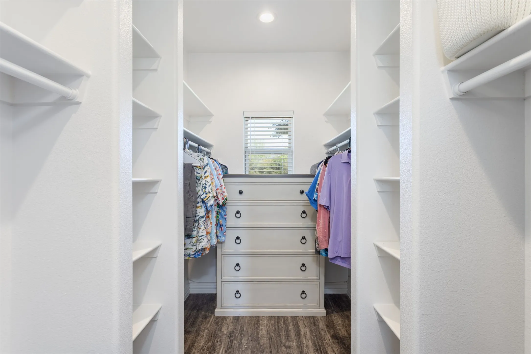 Large Primary closet with built-in shelves.