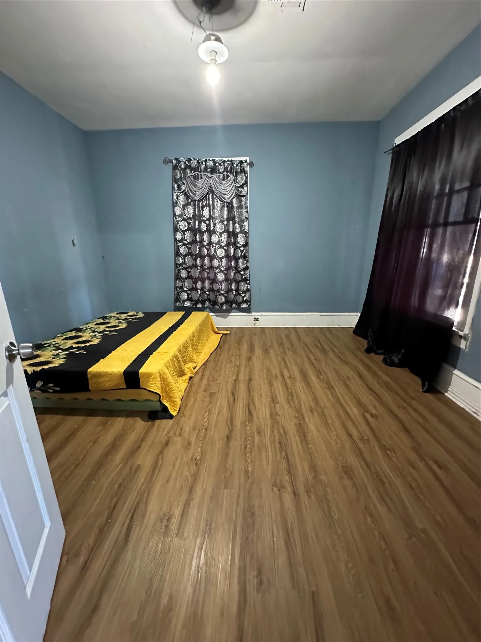 Bedroom with wood finished floors