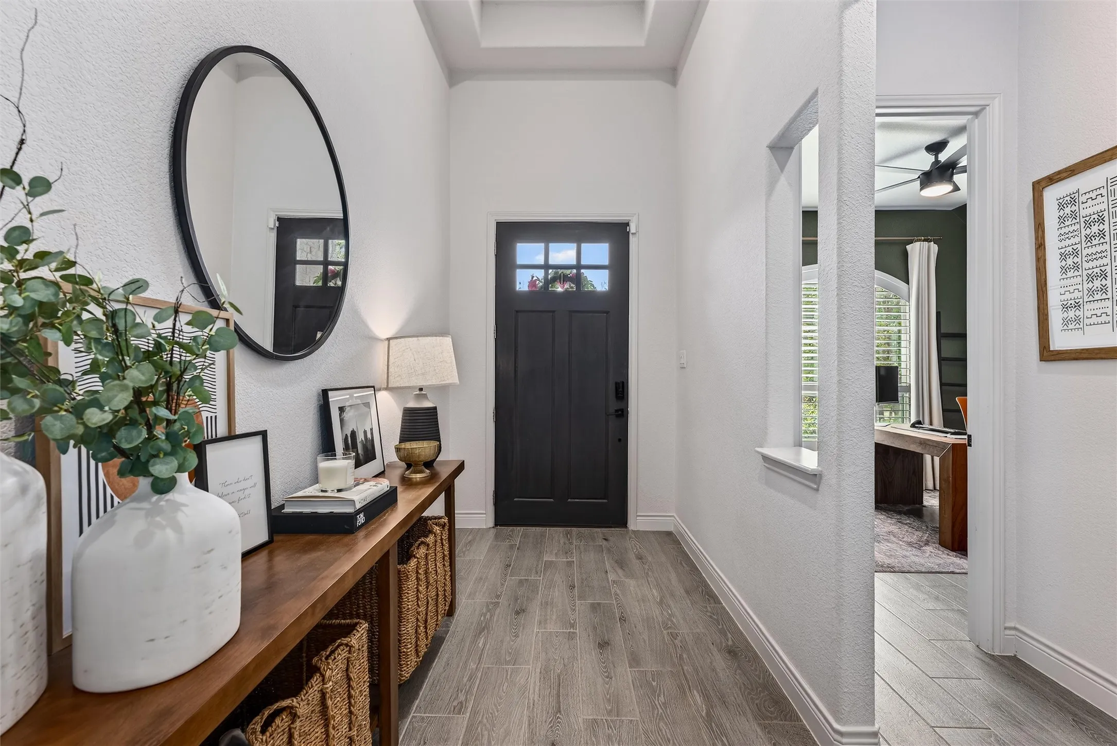 Large hallway with great lighting and beautiful arches.