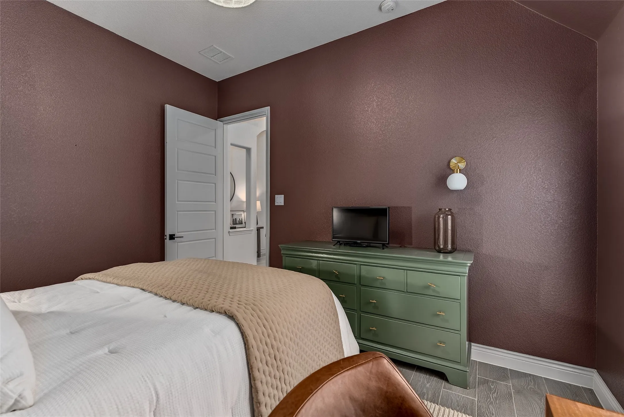 Primary bathroom with separate vanities and a spa like feel.