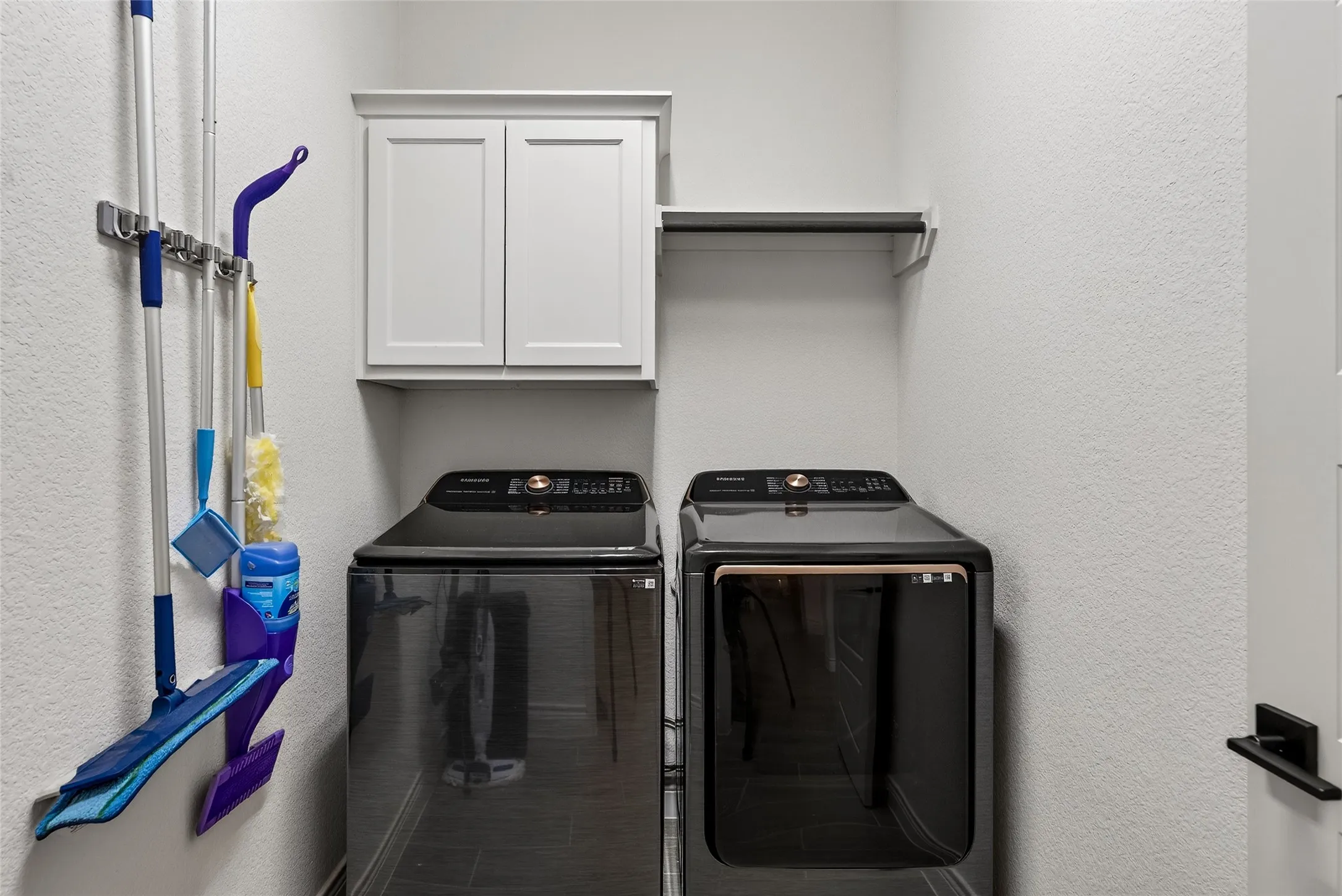 Utility room with built in cabinets.
