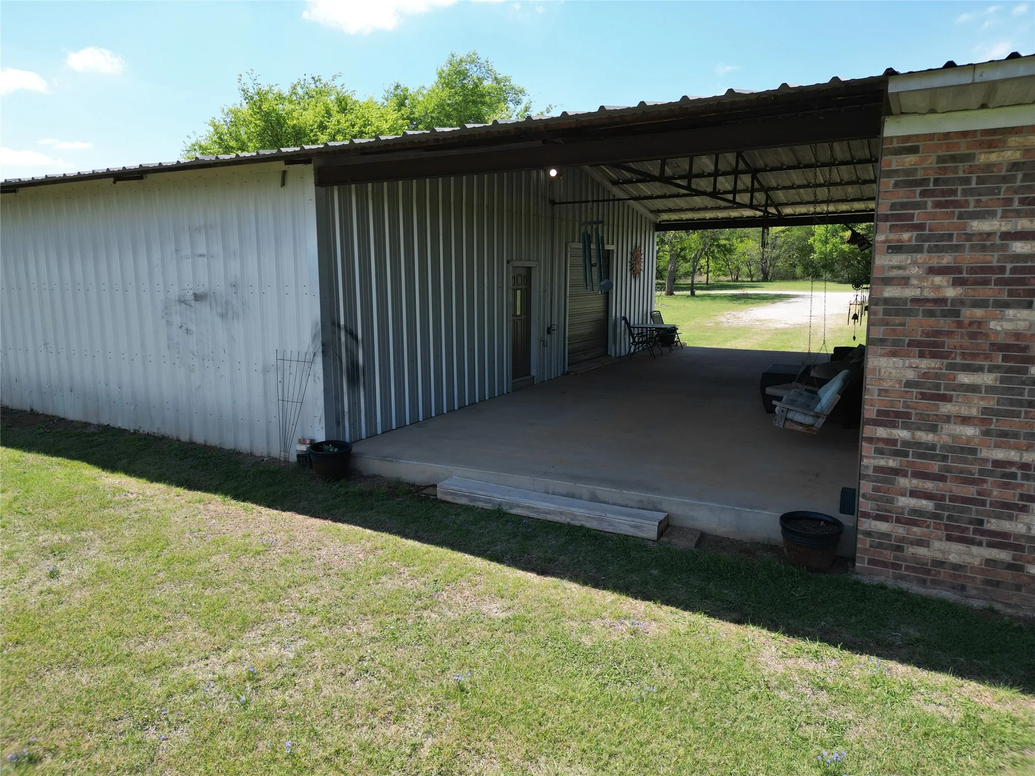 View of outbuilding featuring a carport
