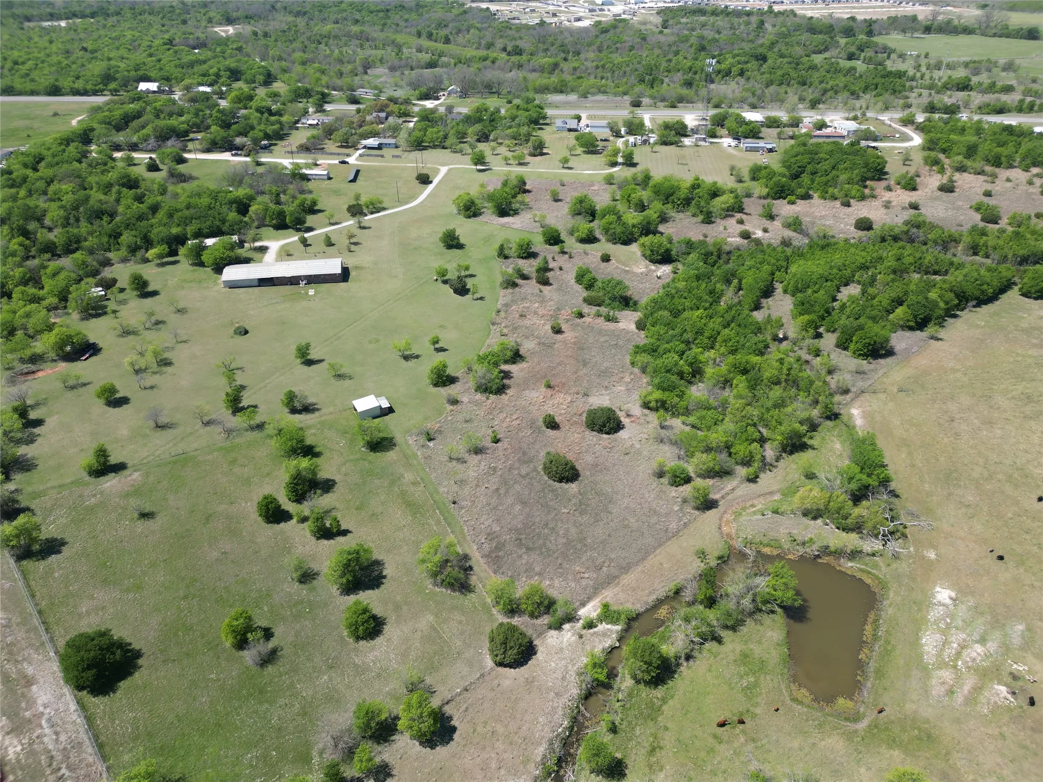 Aerial view of sparsely populated area with a large body of water