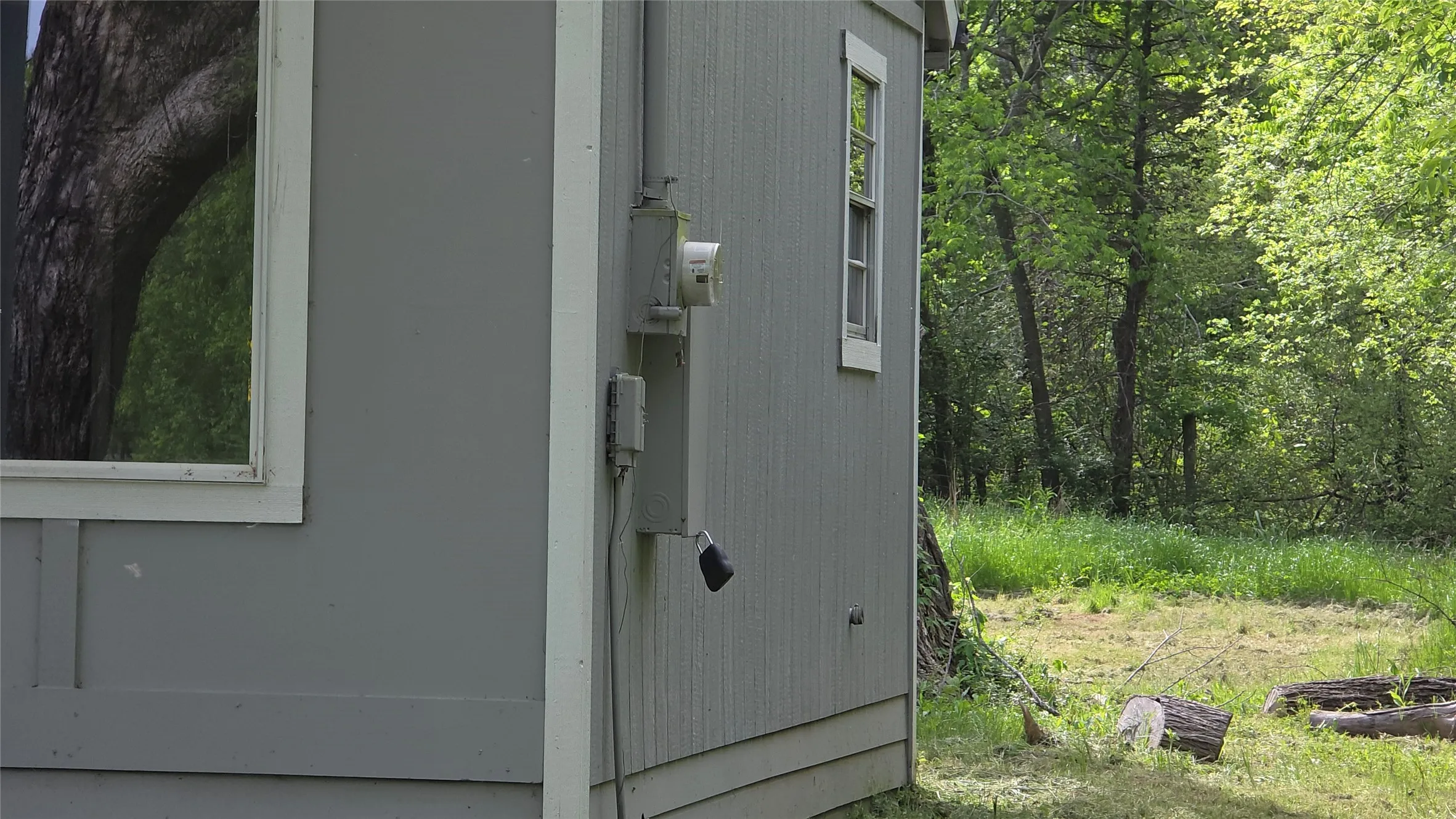 Exterior view of electric meter and lockbox placement