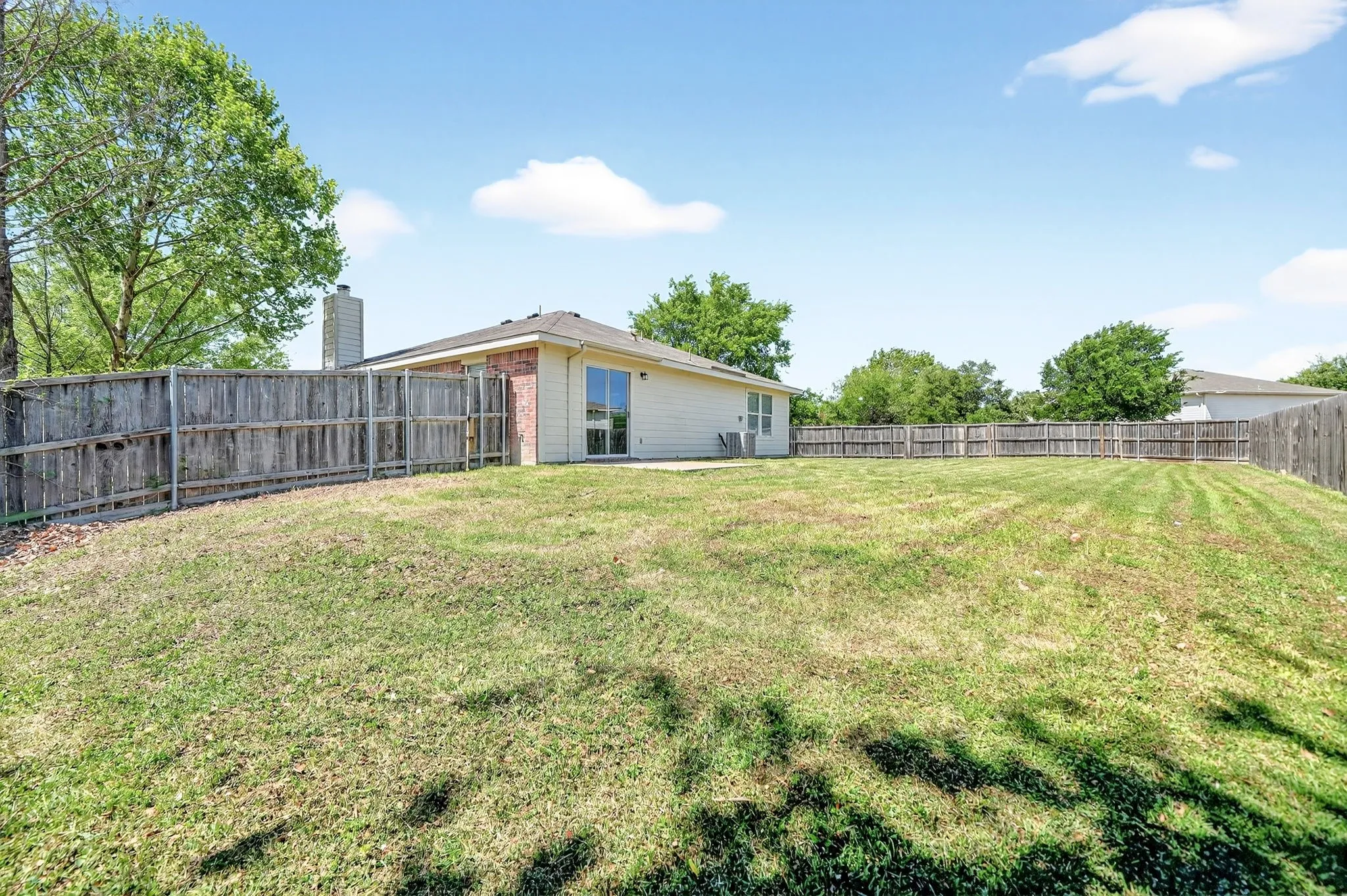 View of fenced backyard